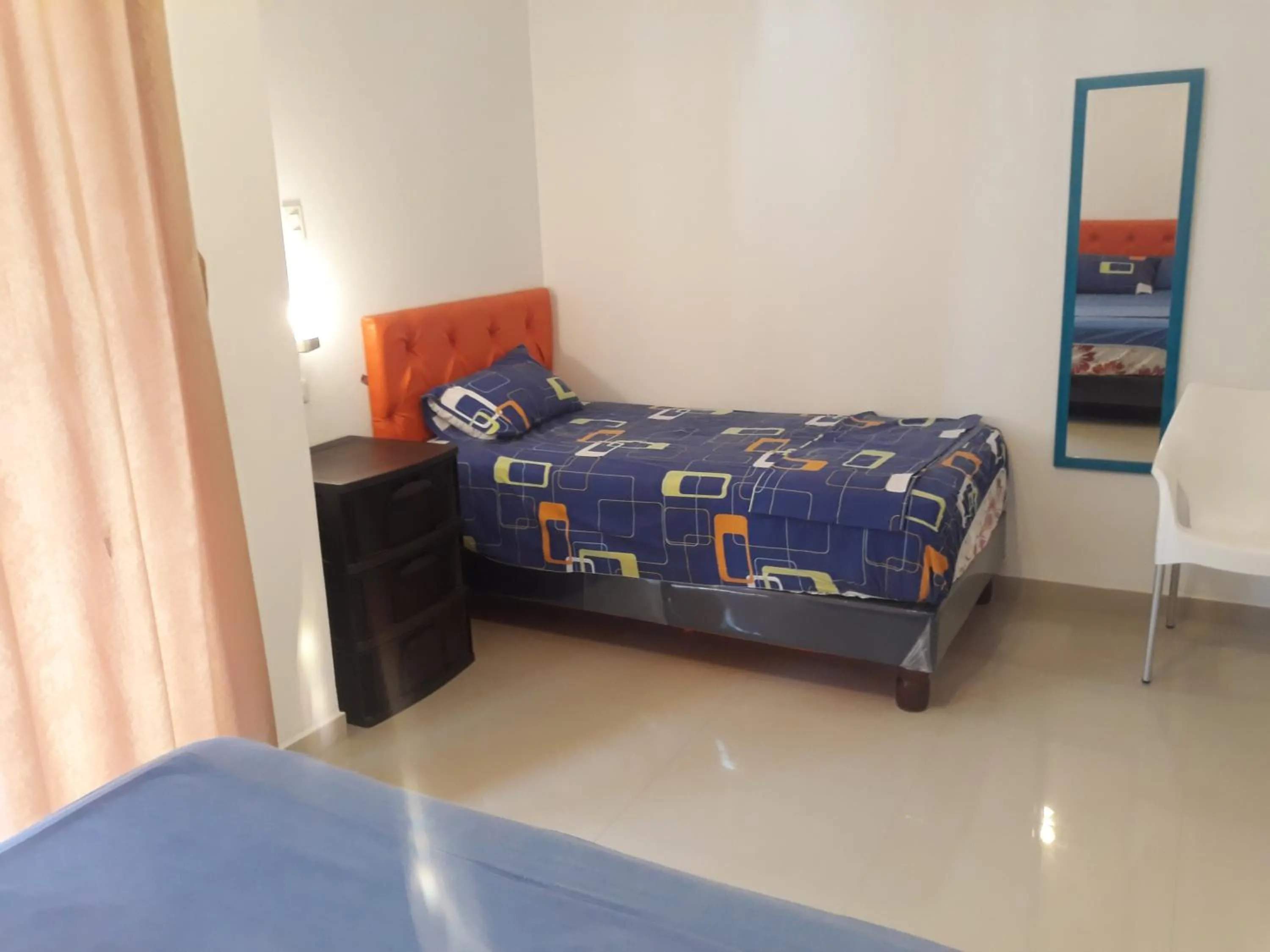 Bed in Hotel Almond Beach