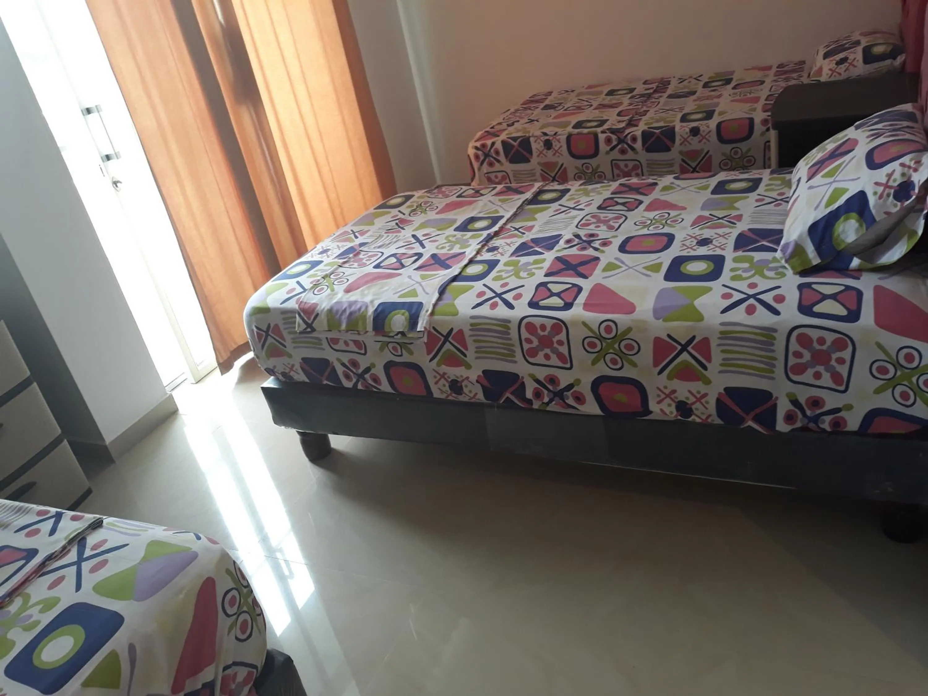 Bed in Hotel Almond Beach