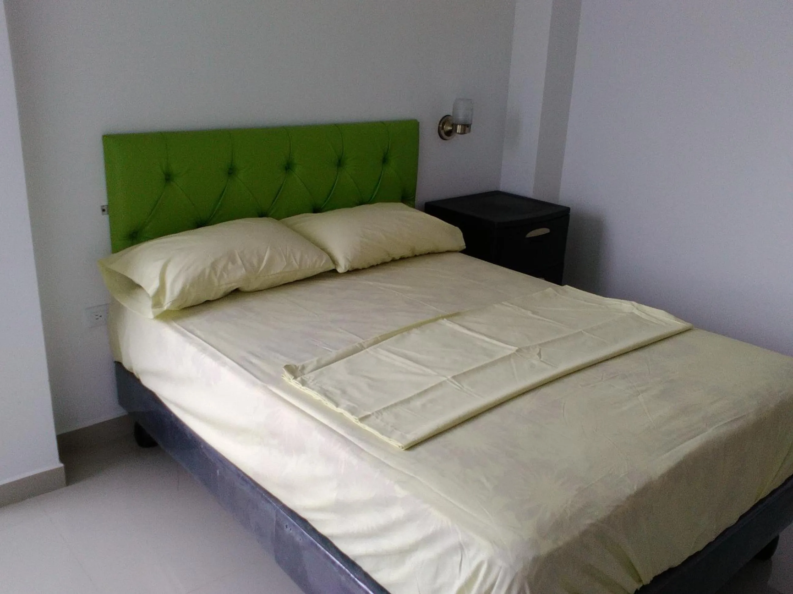 Bed in Hotel Almond Beach