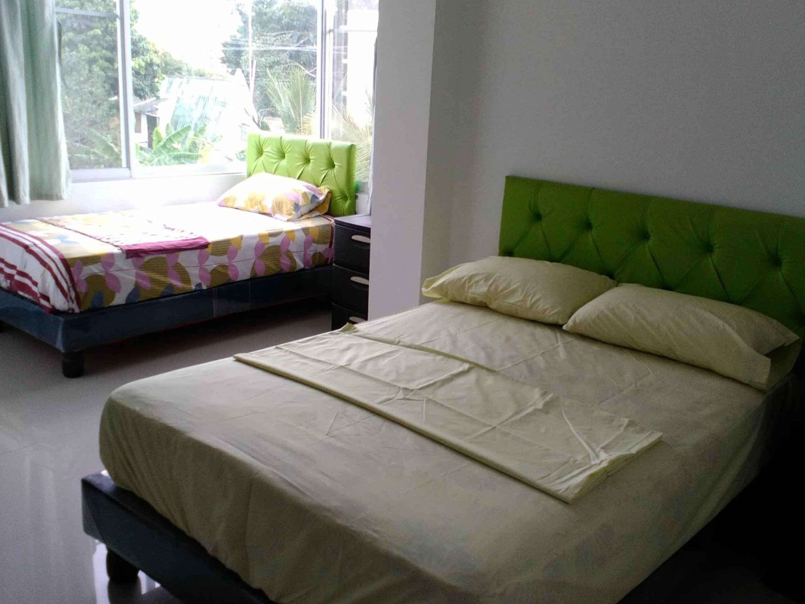 Bed in Hotel Almond Beach