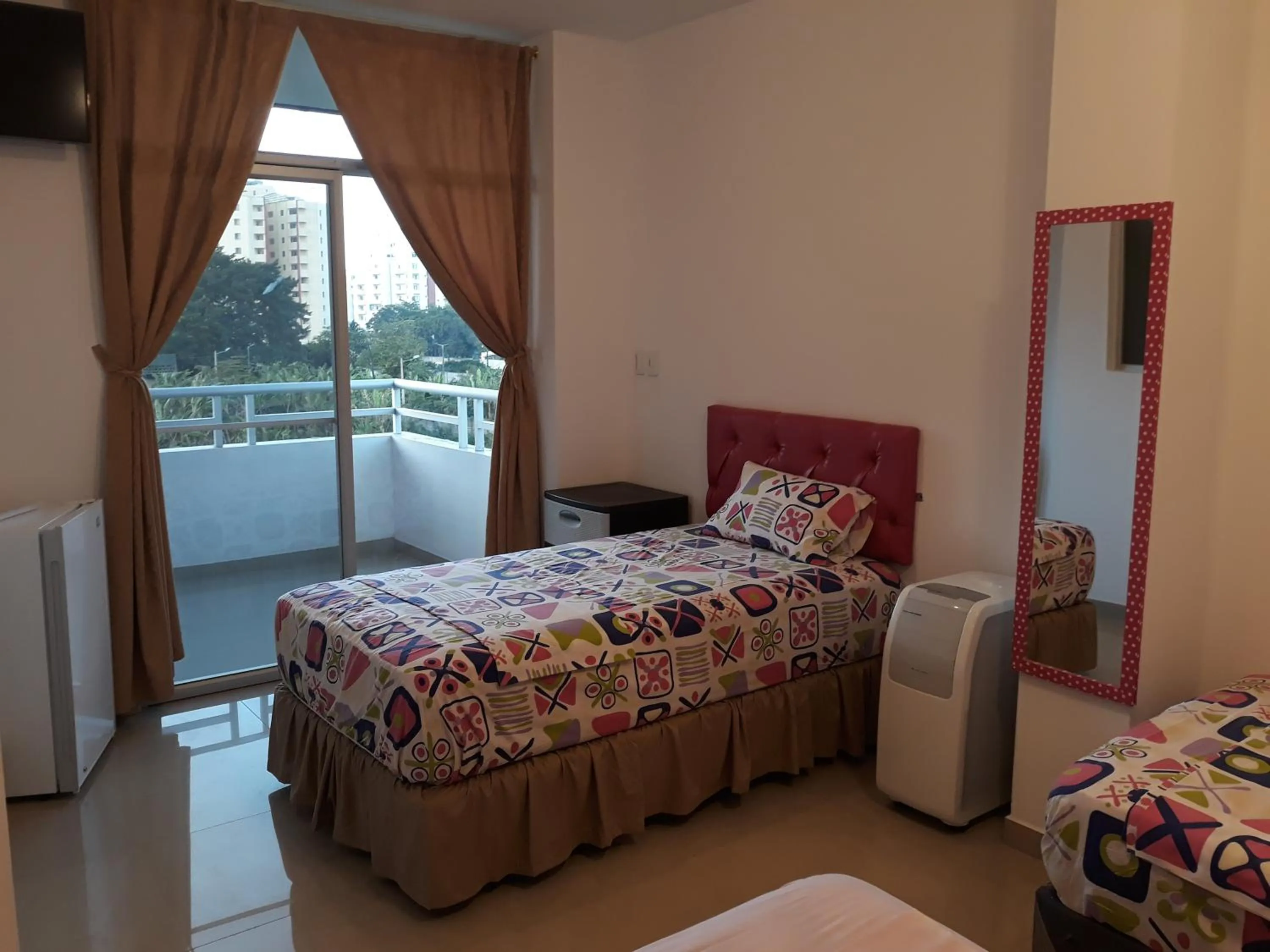 Bed in Hotel Almond Beach