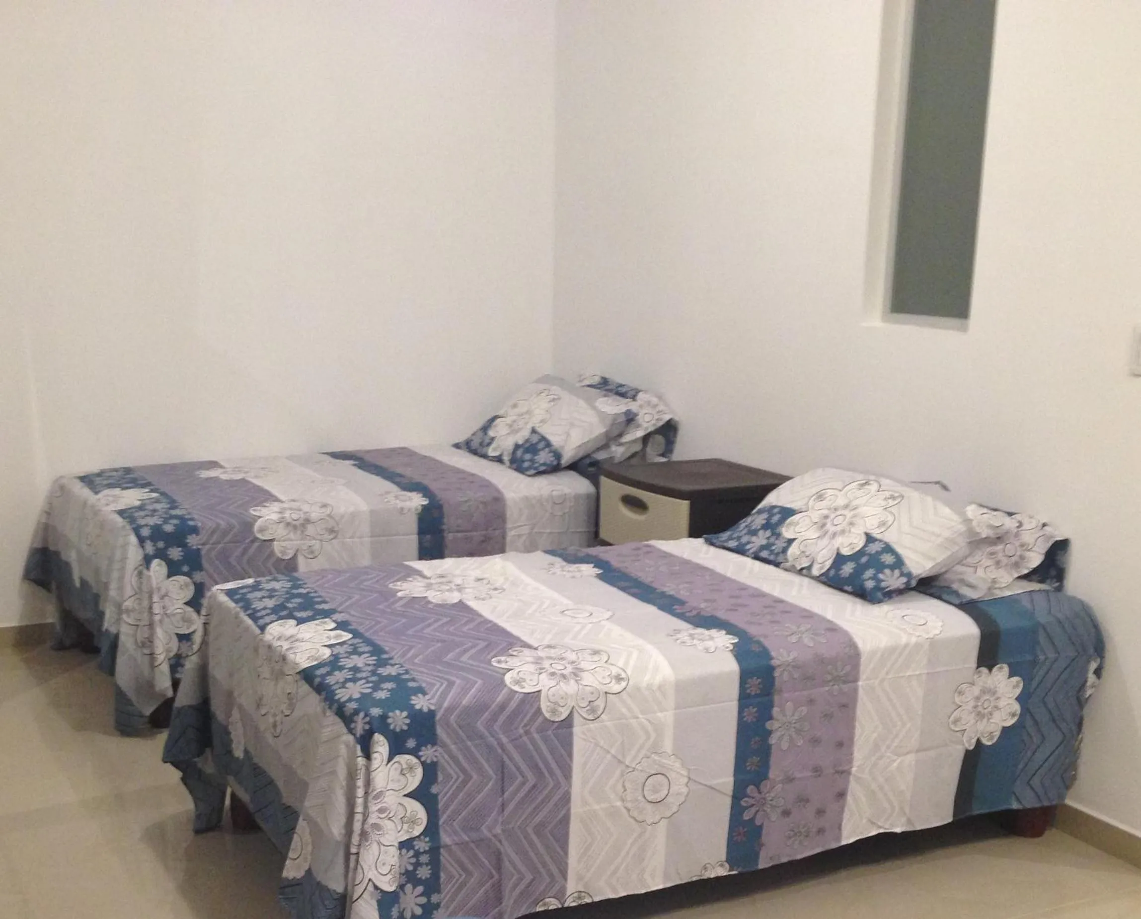 Bed in Hotel Almond Beach