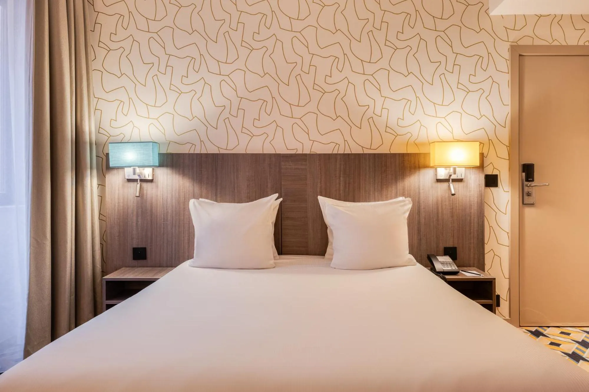 Bed in ALMA Grand Place Hotel