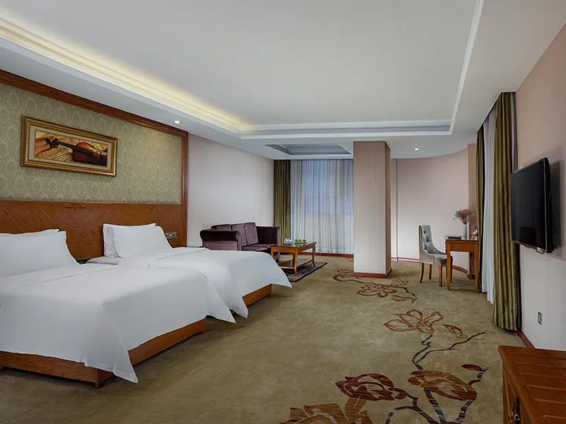 Bed in Vienna Hotel Huizhou Chenjiang Avenue