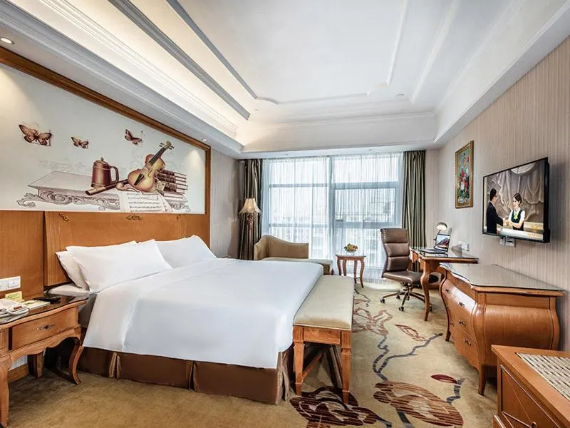 Bed in Vienna International Hotel Xinyang Yangshan New District
