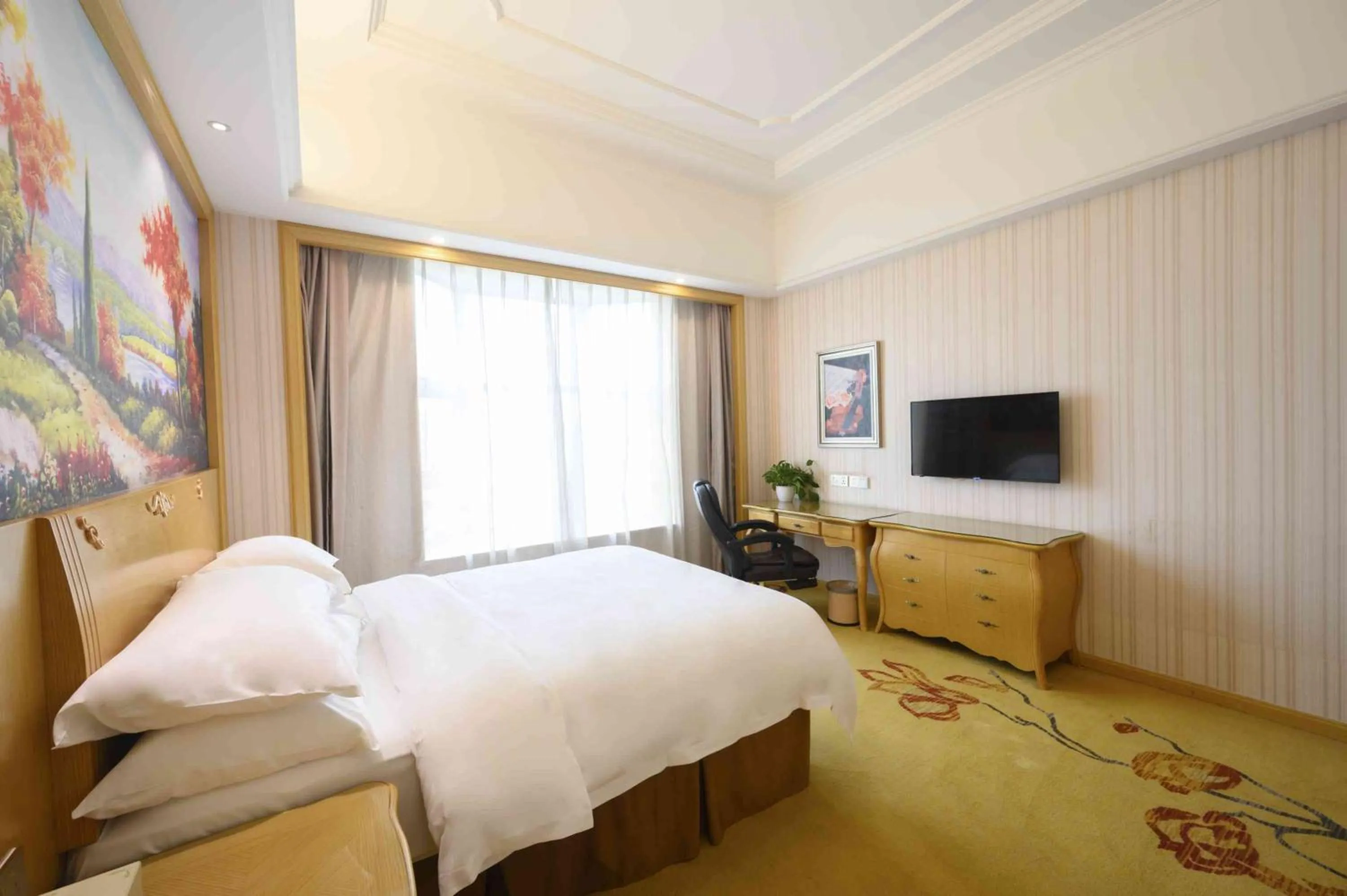 Bed in Vienna International Hotel Shanghai Malu Station