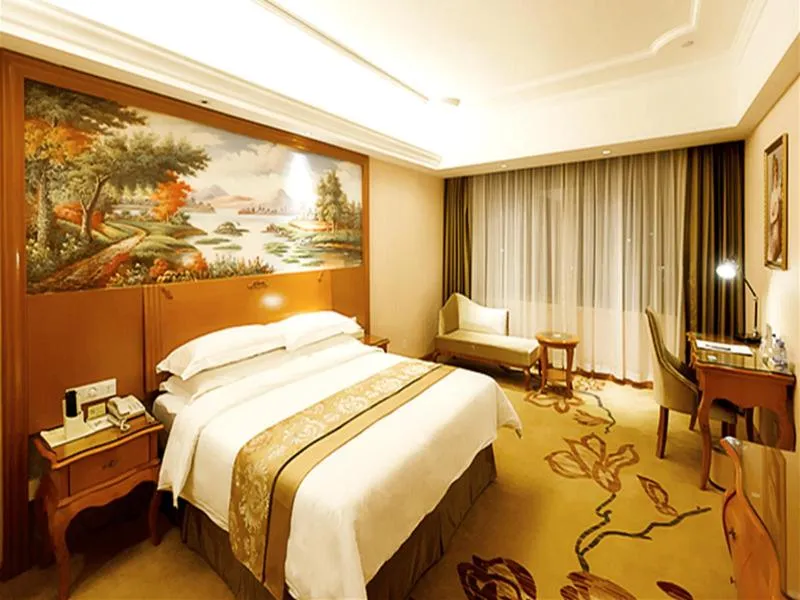 Bed in Vienna Hotel Shaoguan Wuli Pavilion