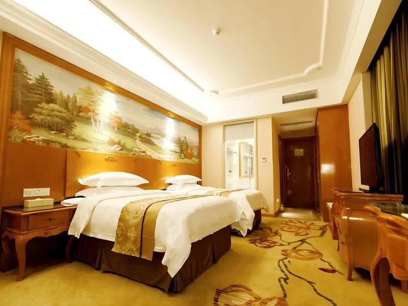 Bed in Vienna Hotel Shaoguan Wuli Pavilion