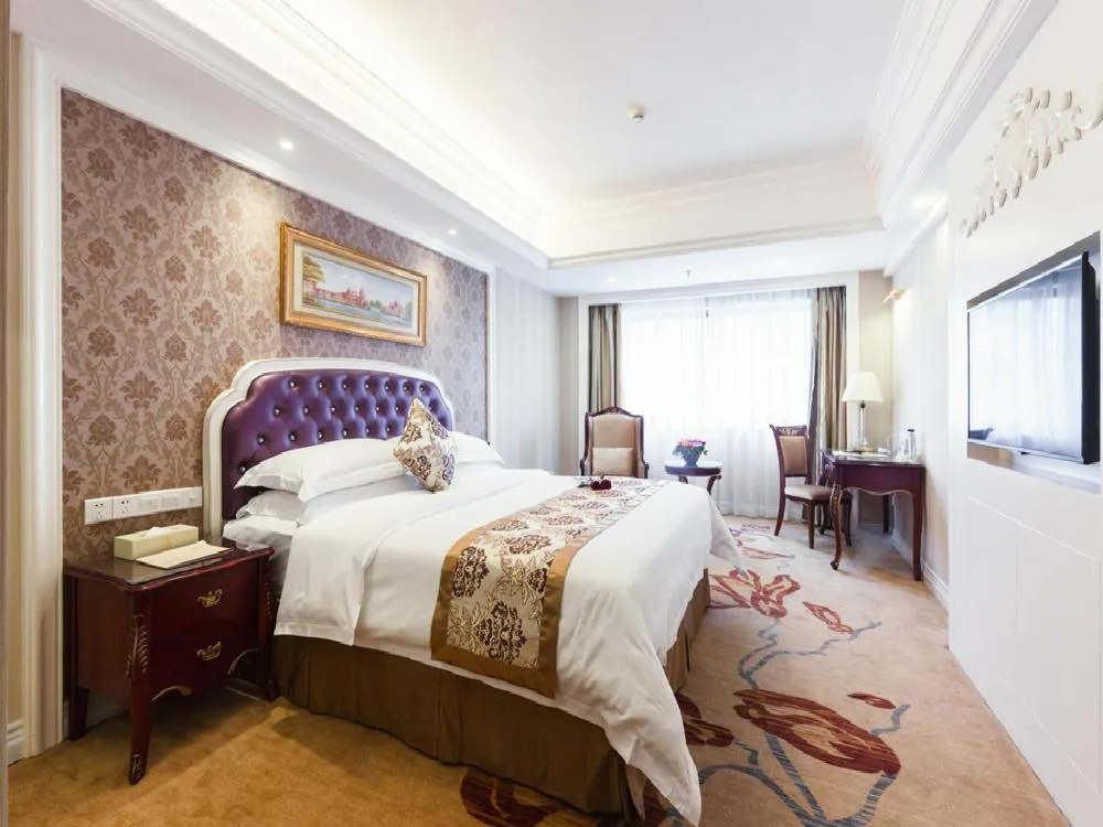 Bed in Vienna International Hotel Nanning Zoo