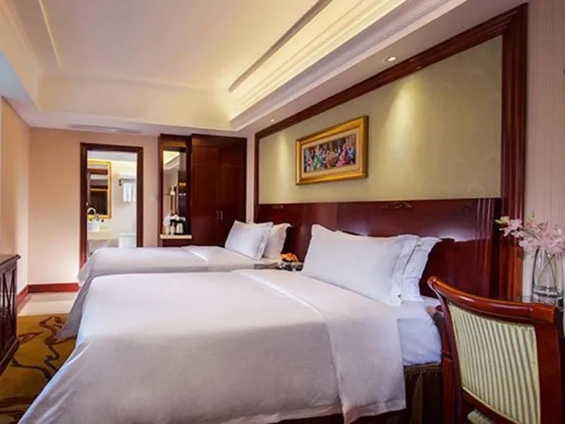 Bed in Vienna Hotel Guangzhou Shiling
