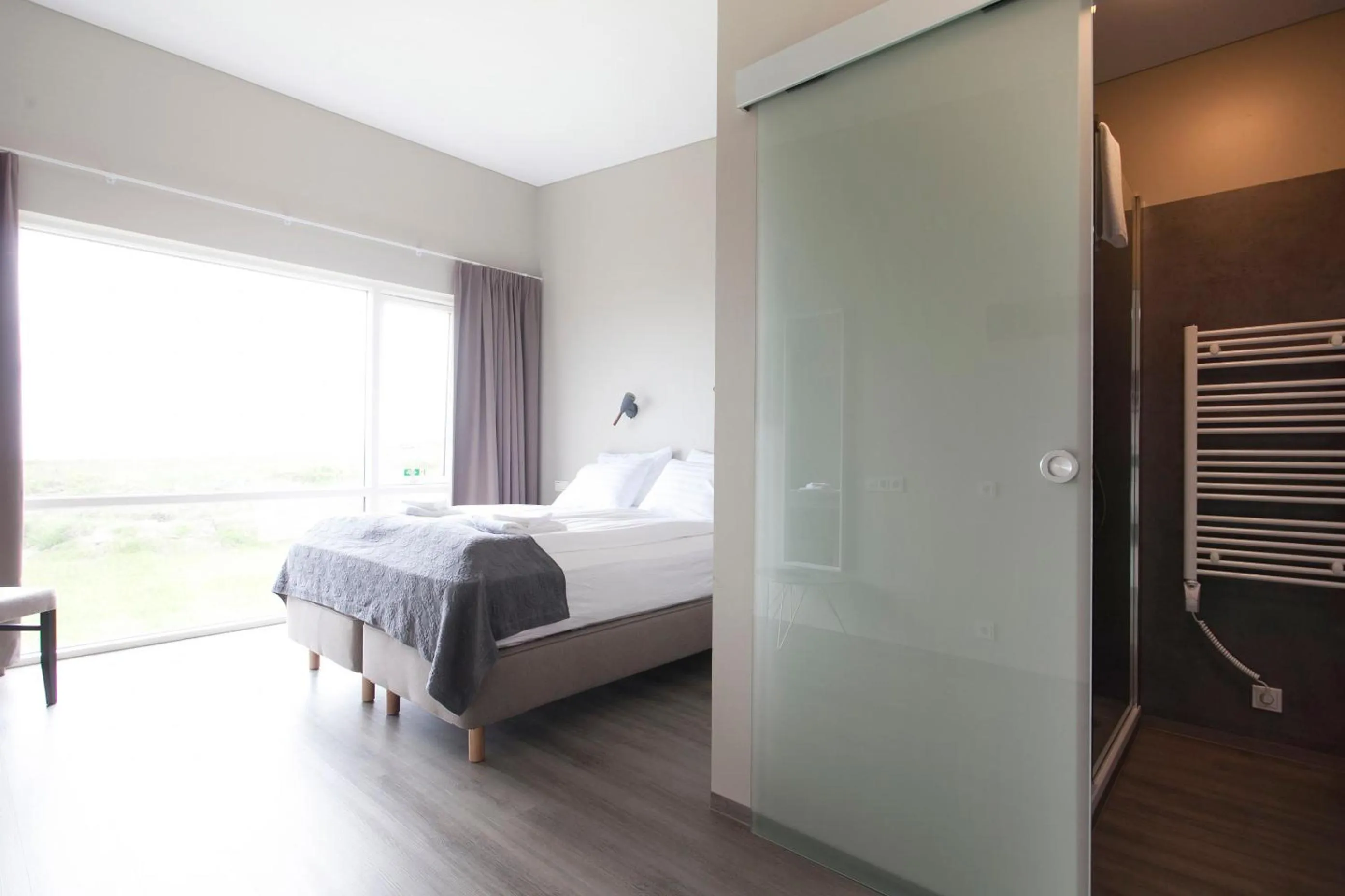 Bathroom, Bed in Arnarstapi Hotel