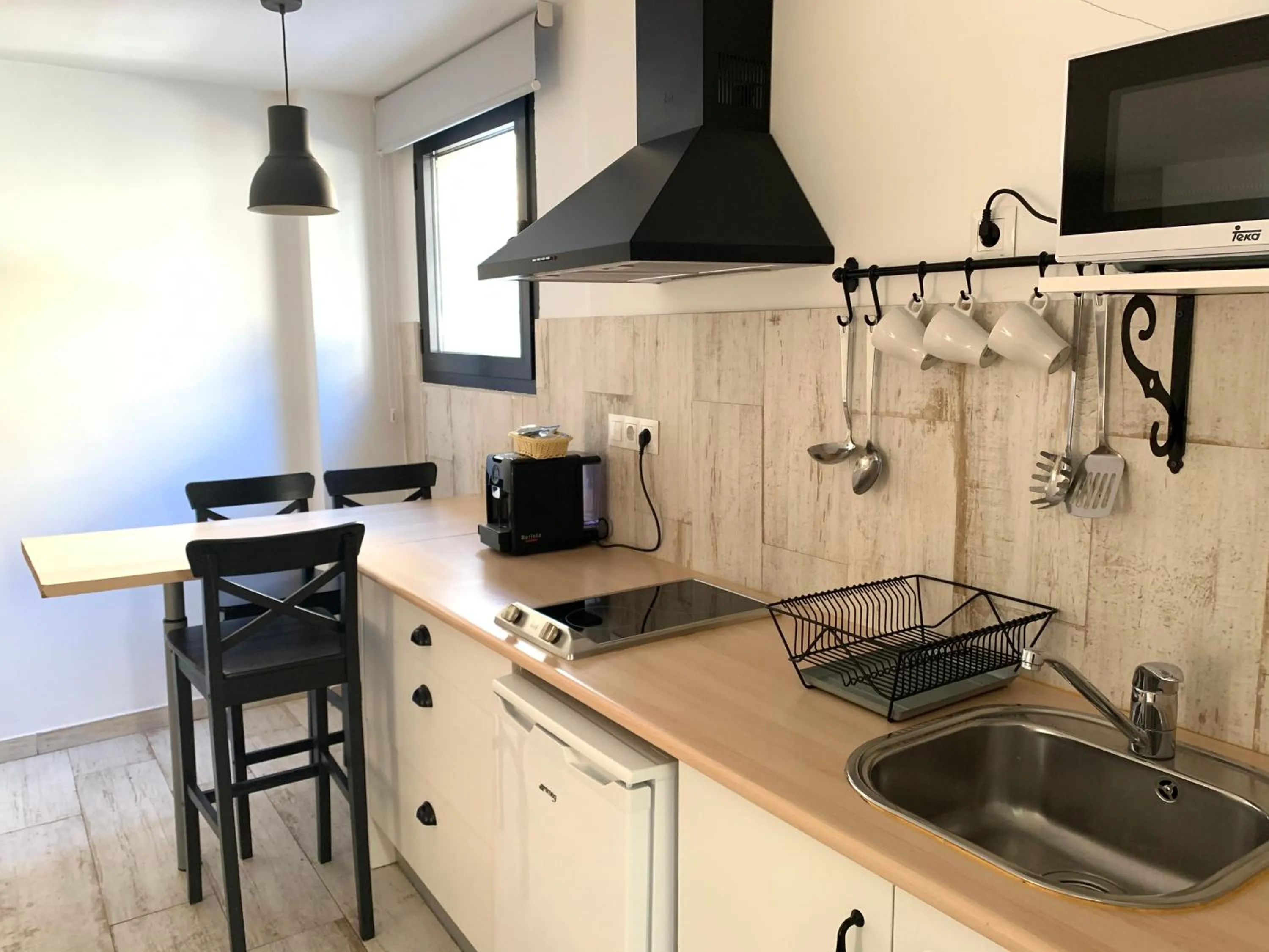 Kitchen or kitchenette in Apartamentos Gorbea Suites