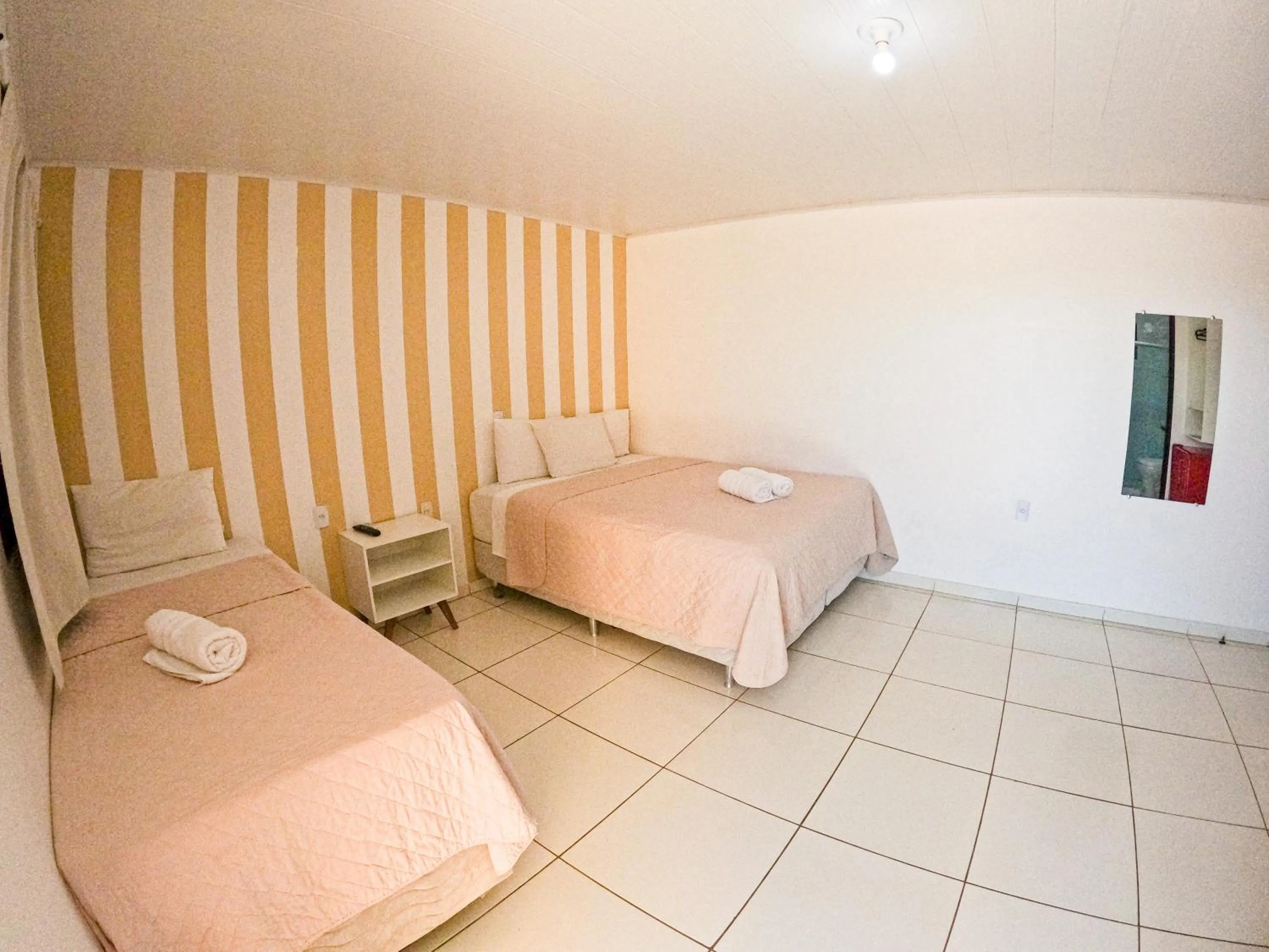 Bed in Pousada Paris