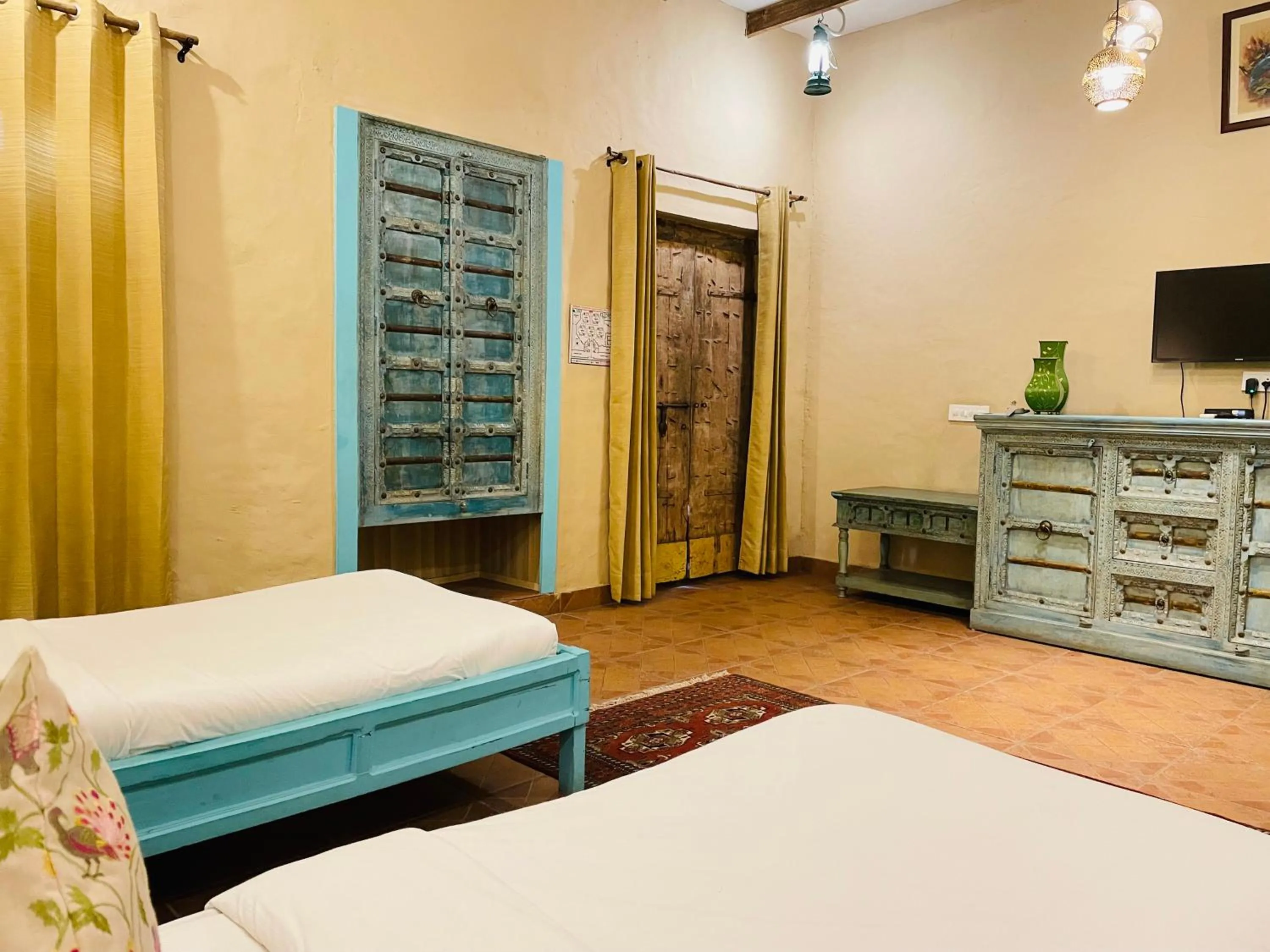 Bed in WelcomHeritage Ranjitvilas