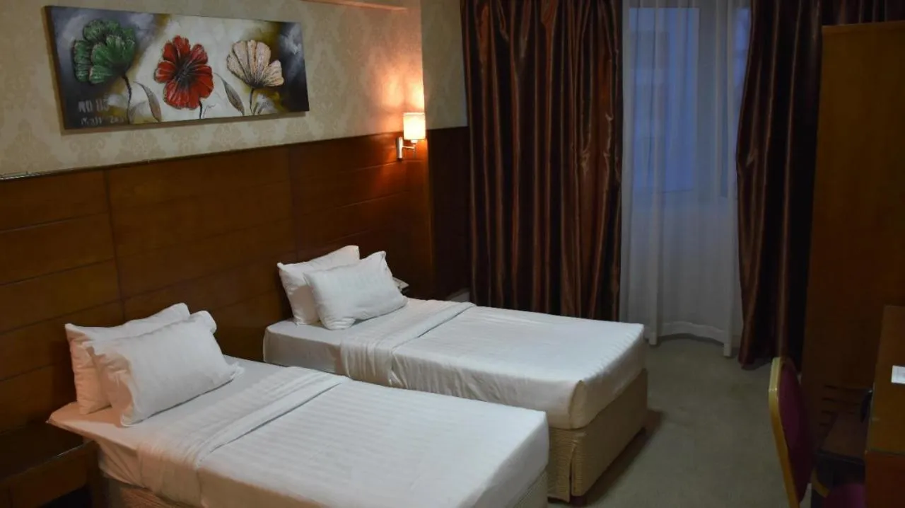 Bed in Mirage Al Salam Hotel