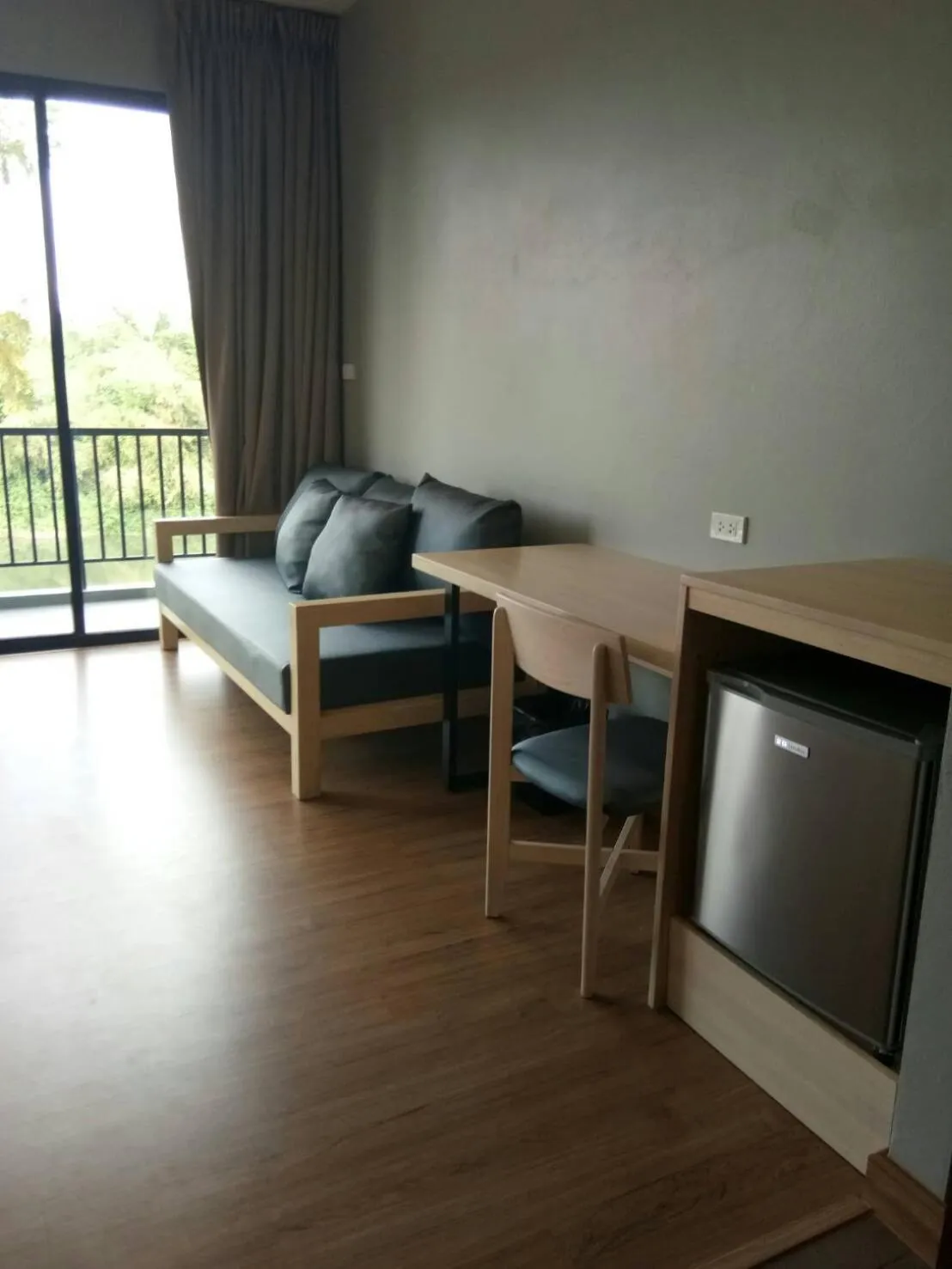 Seating area, Bed in Riverawan Hotel