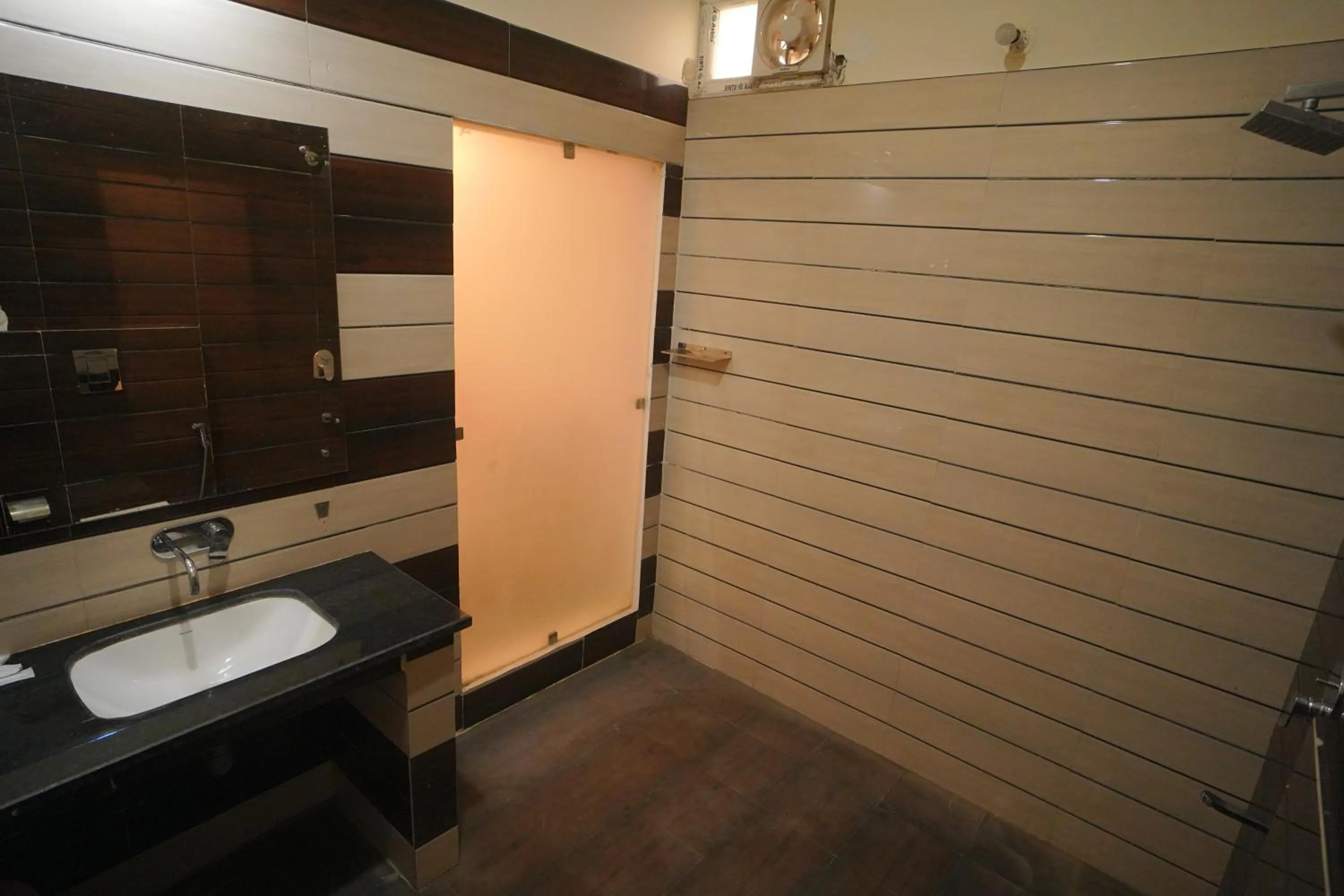 Bathroom in Dhawala Resort By Aamod