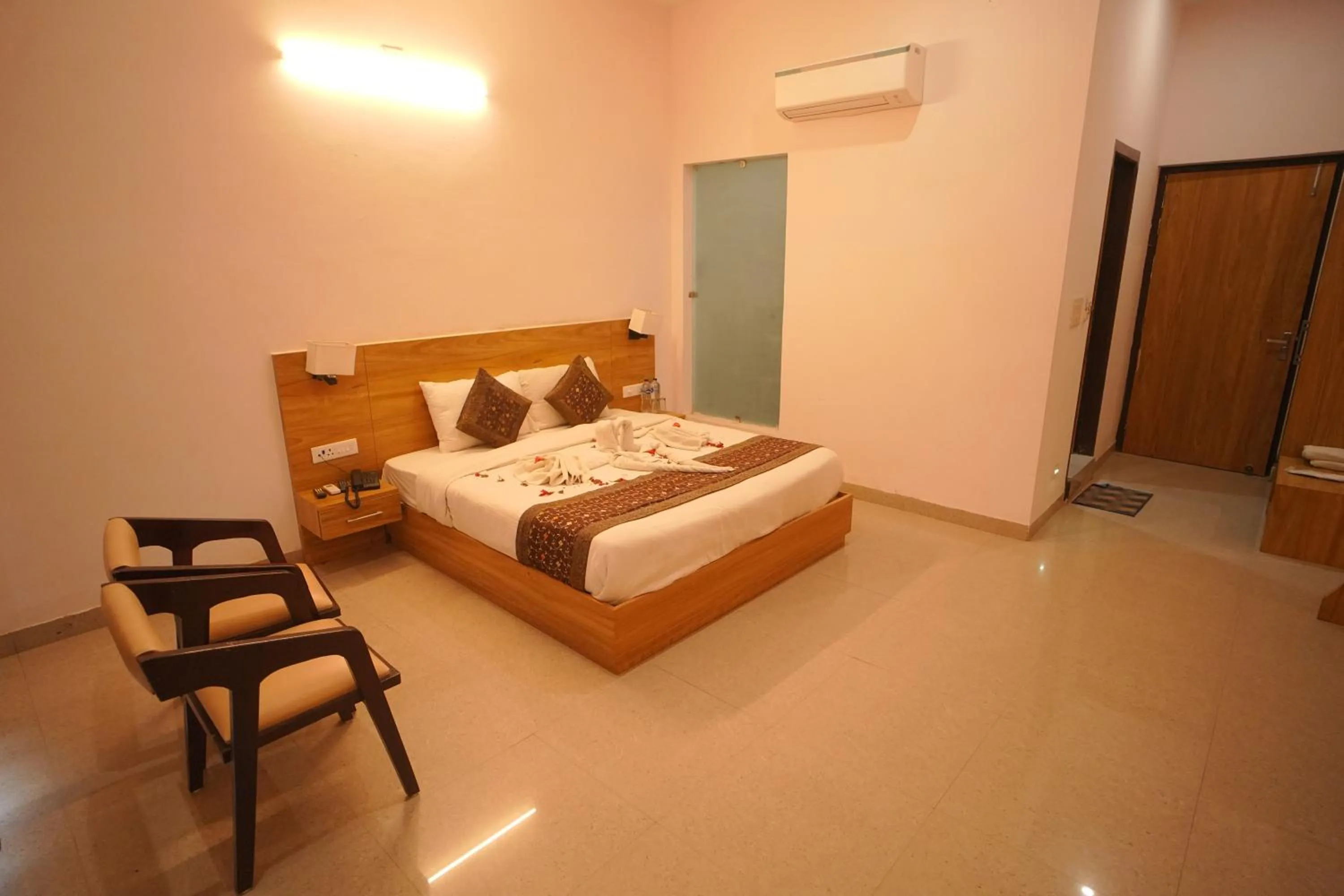 Bed in Dhawala Resort By Aamod