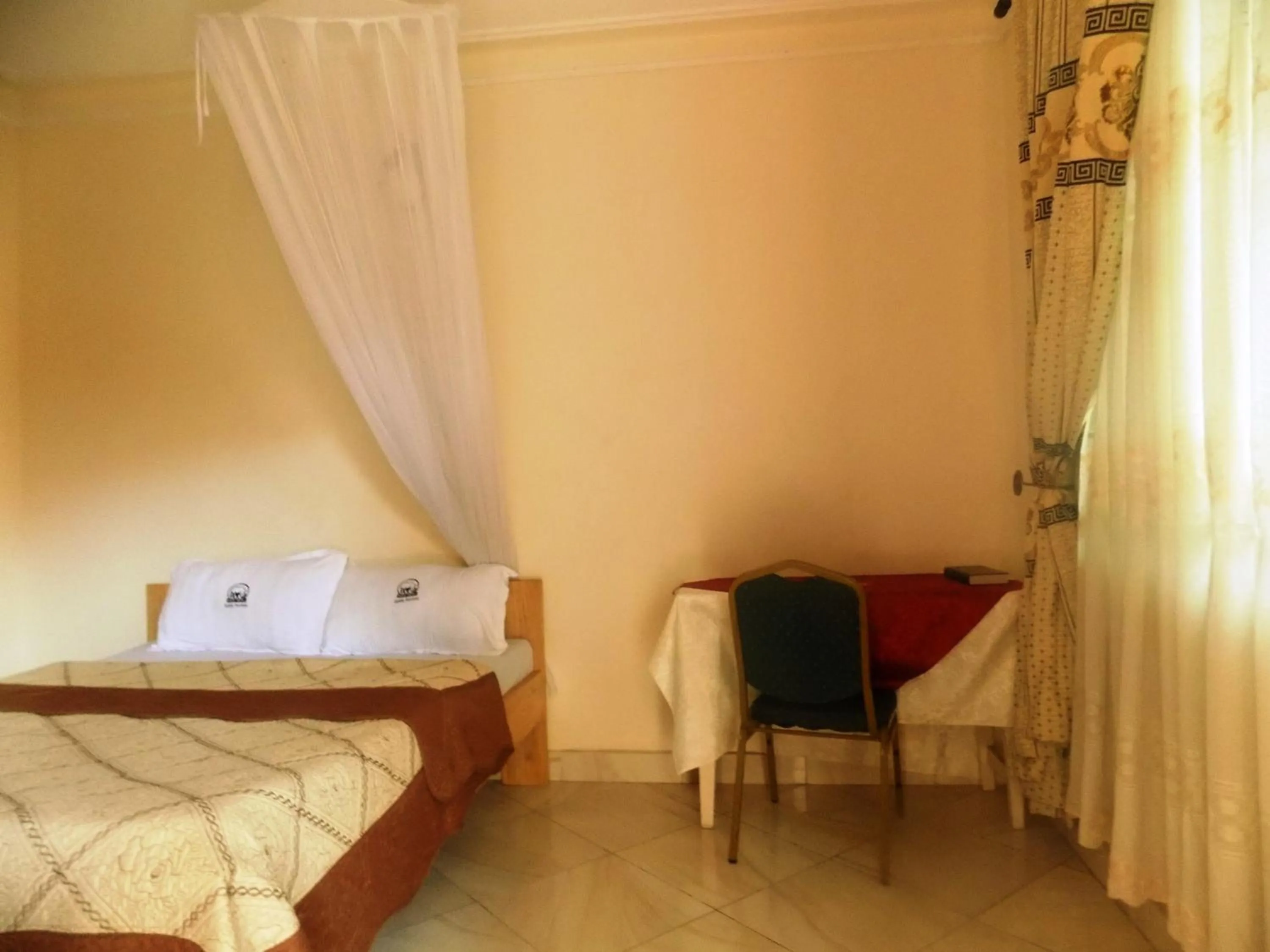 Bed in Rhino Motel Mbarara