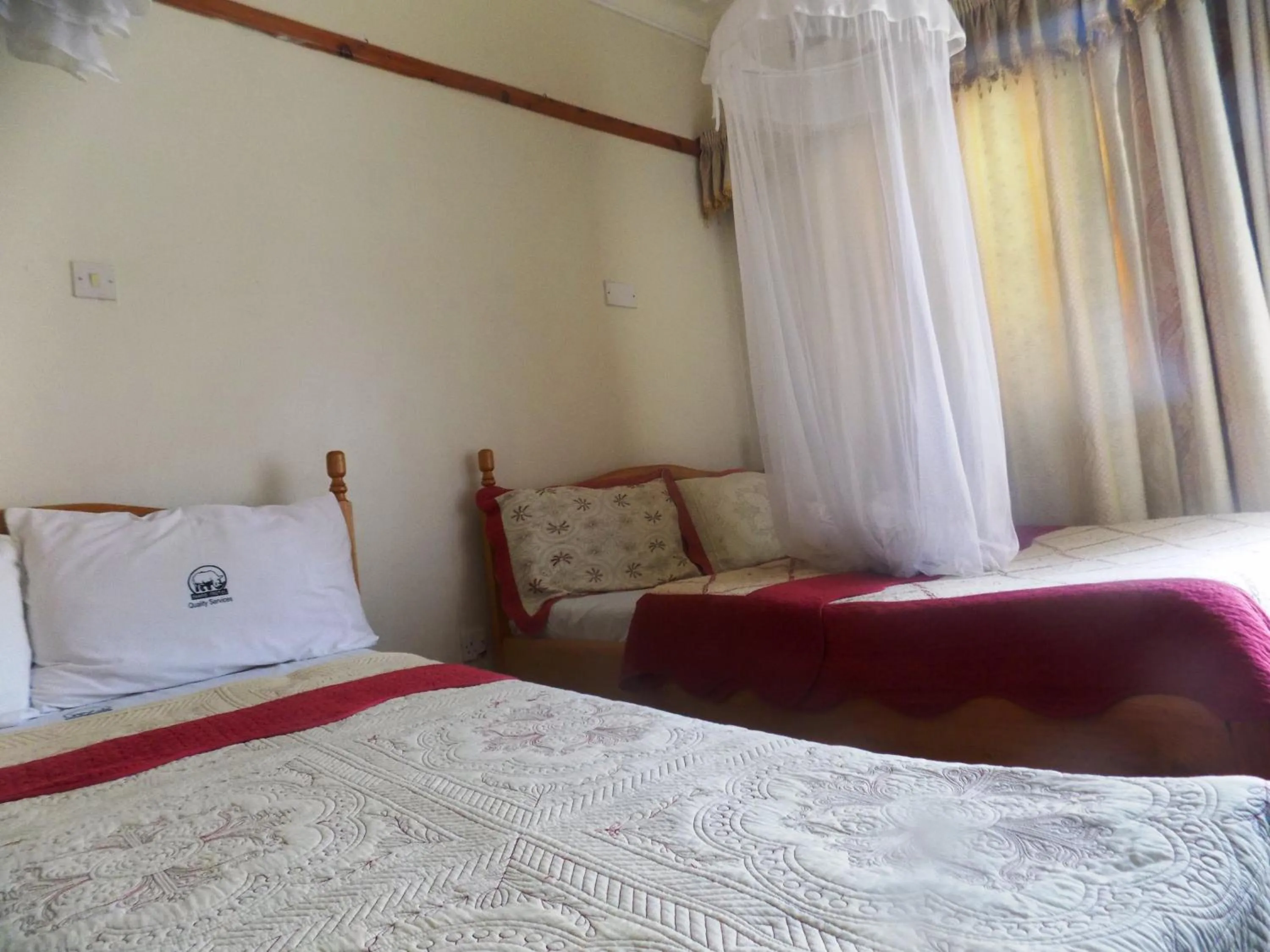 Bed in Rhino Motel Mbarara