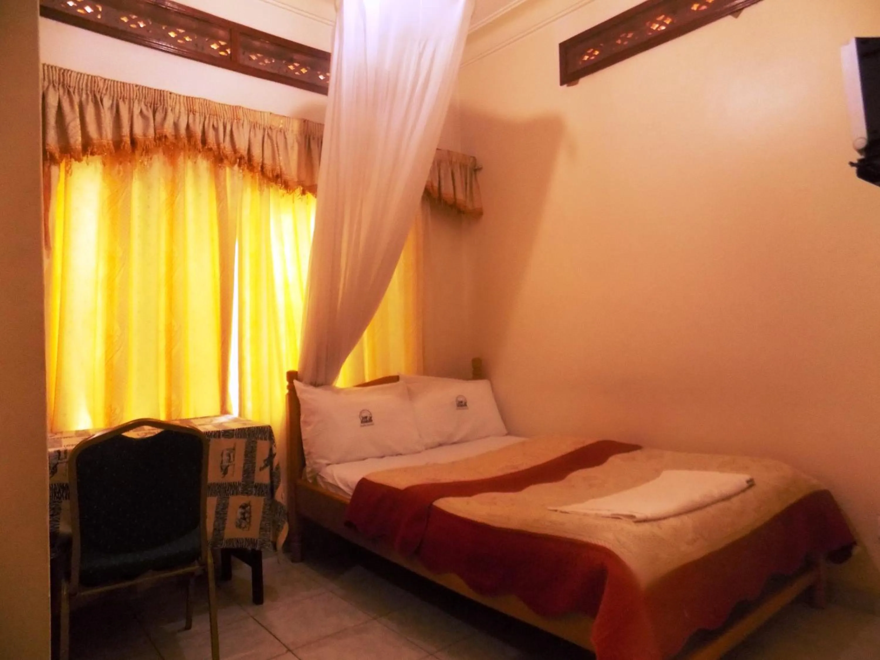 Bed in Rhino Motel Mbarara