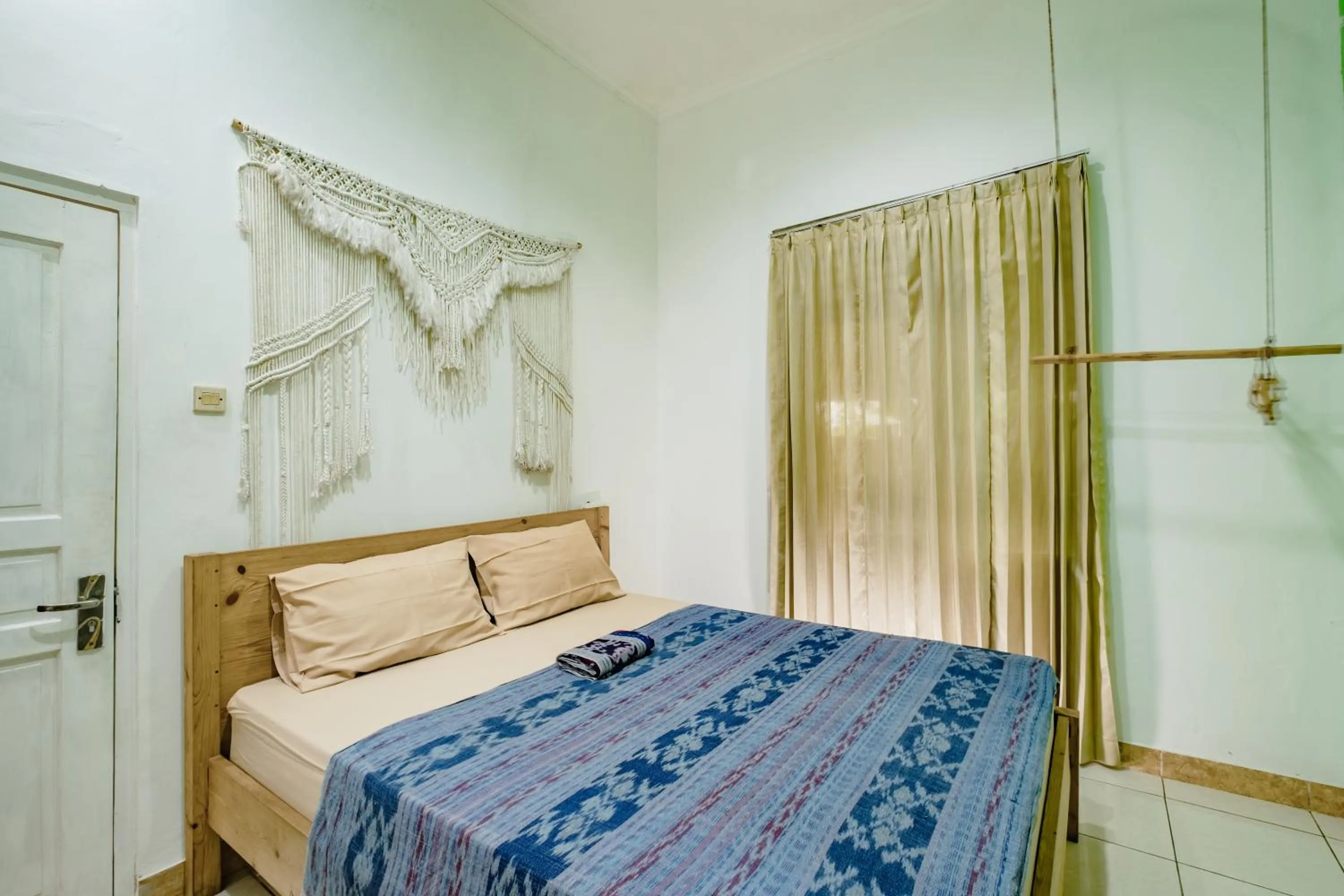 air conditioner, Bed in Happy Buddha Yogyakarta