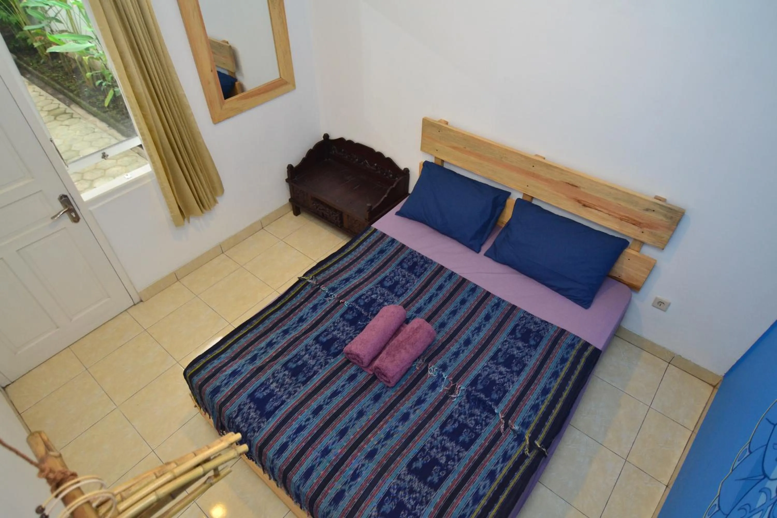 Bed in Happy Buddha Yogyakarta