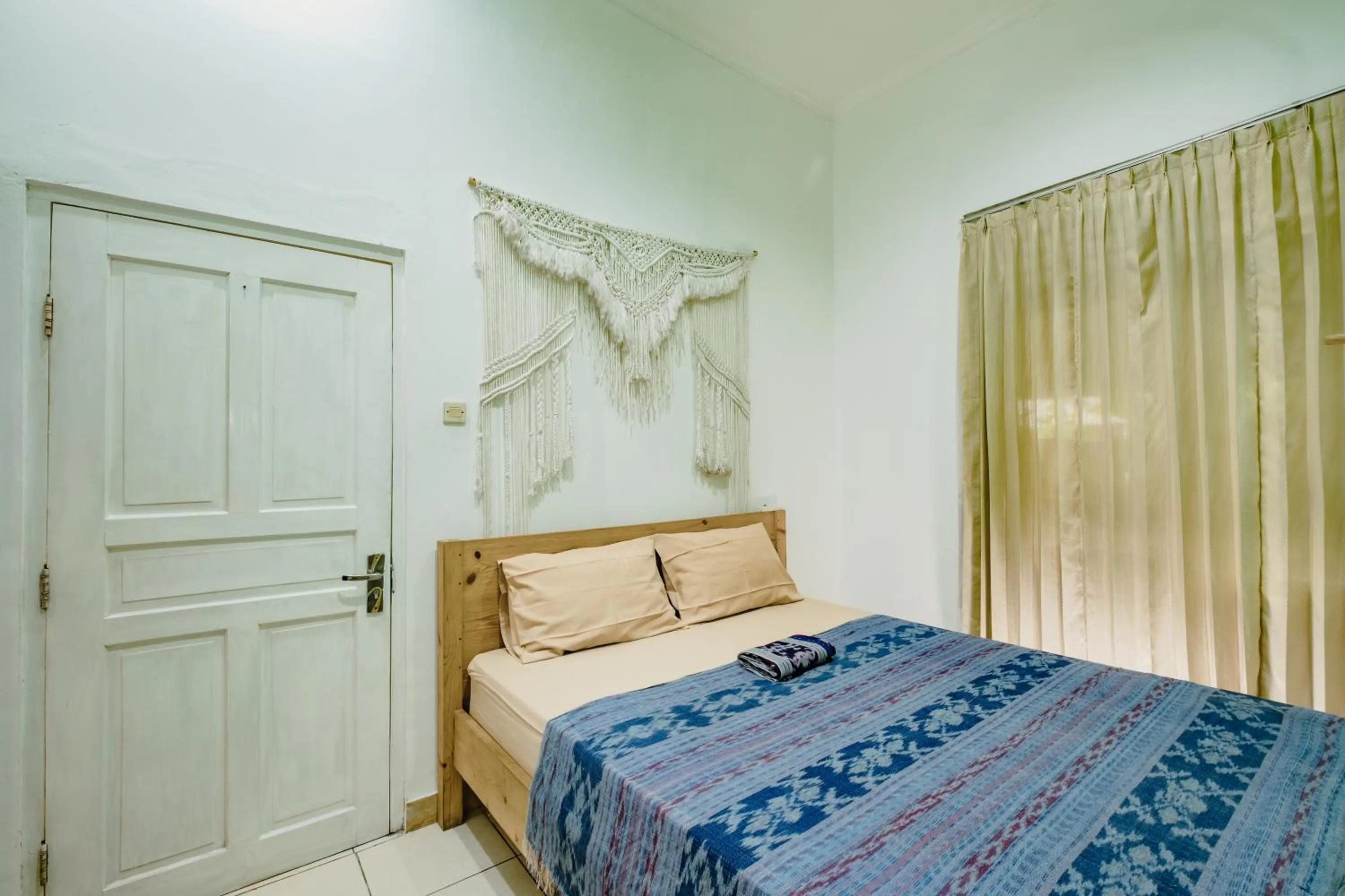 air conditioner, Bed in Happy Buddha Yogyakarta