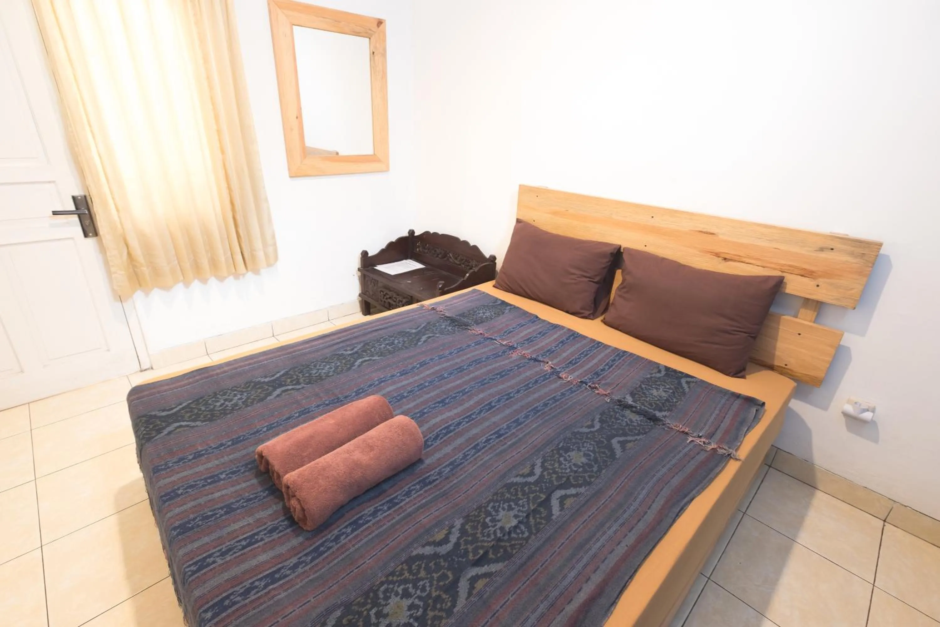 Bed in Happy Buddha Yogyakarta