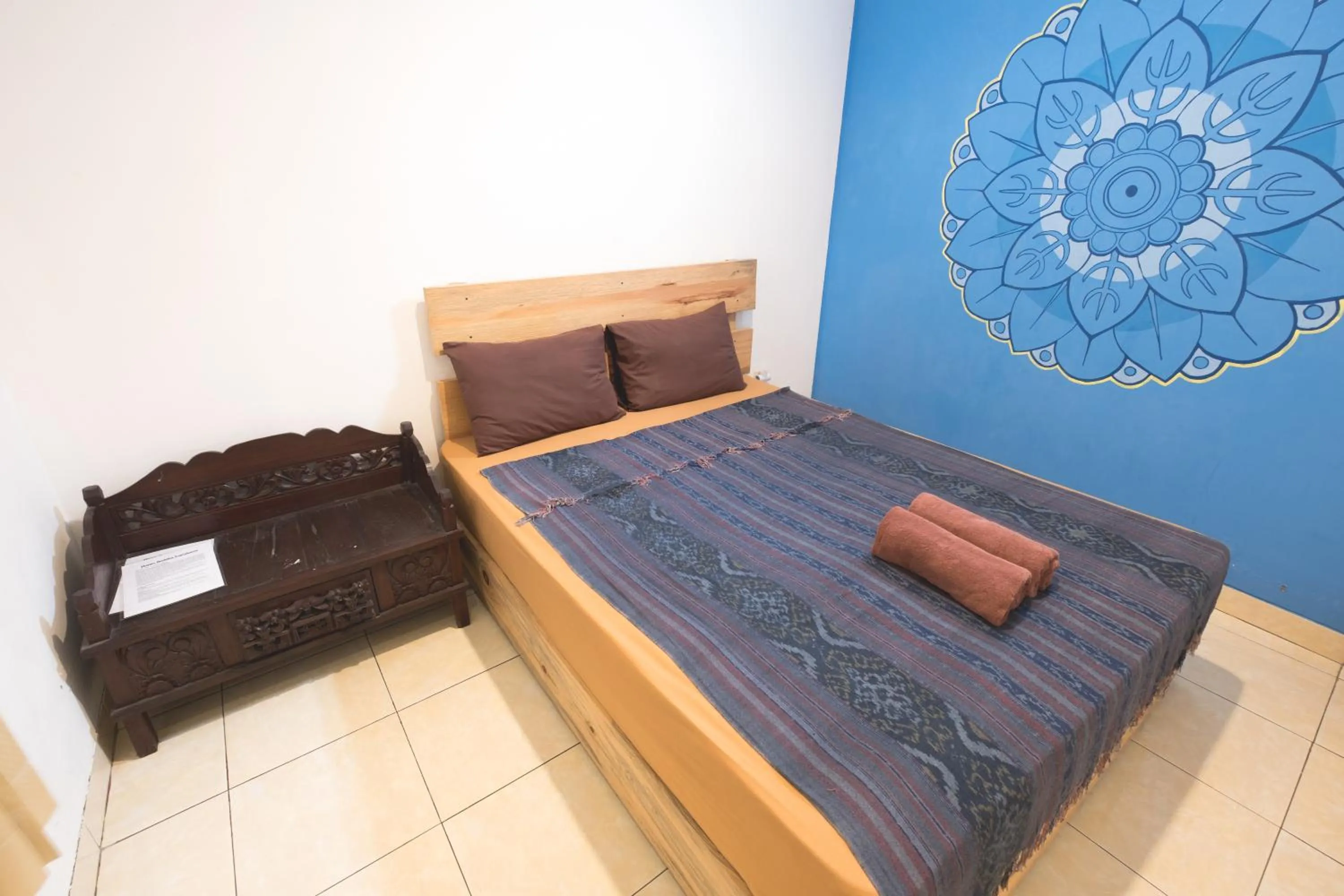 Bed in Happy Buddha Yogyakarta