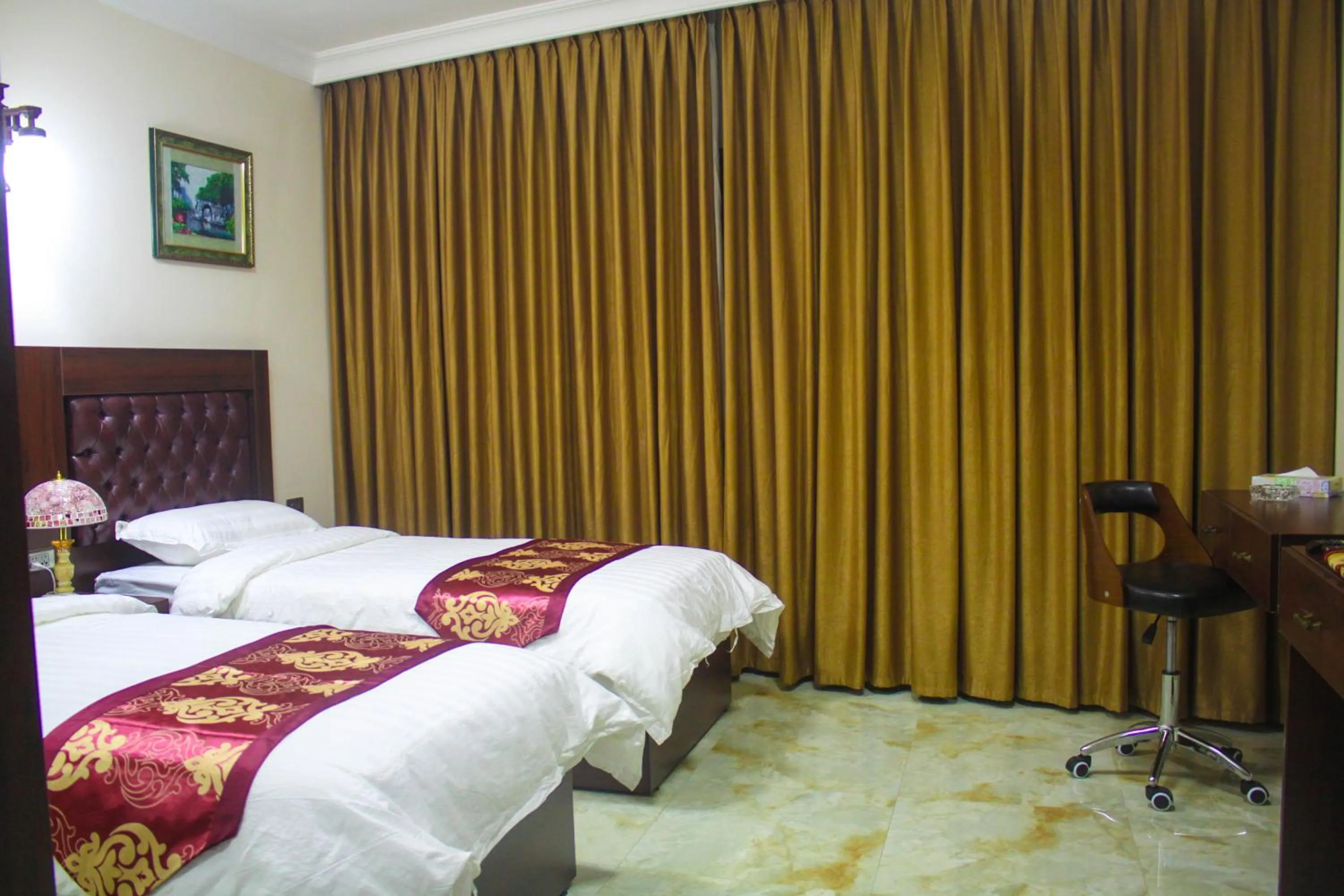 Bed in Qaser Al-Sultan Hotel Suites