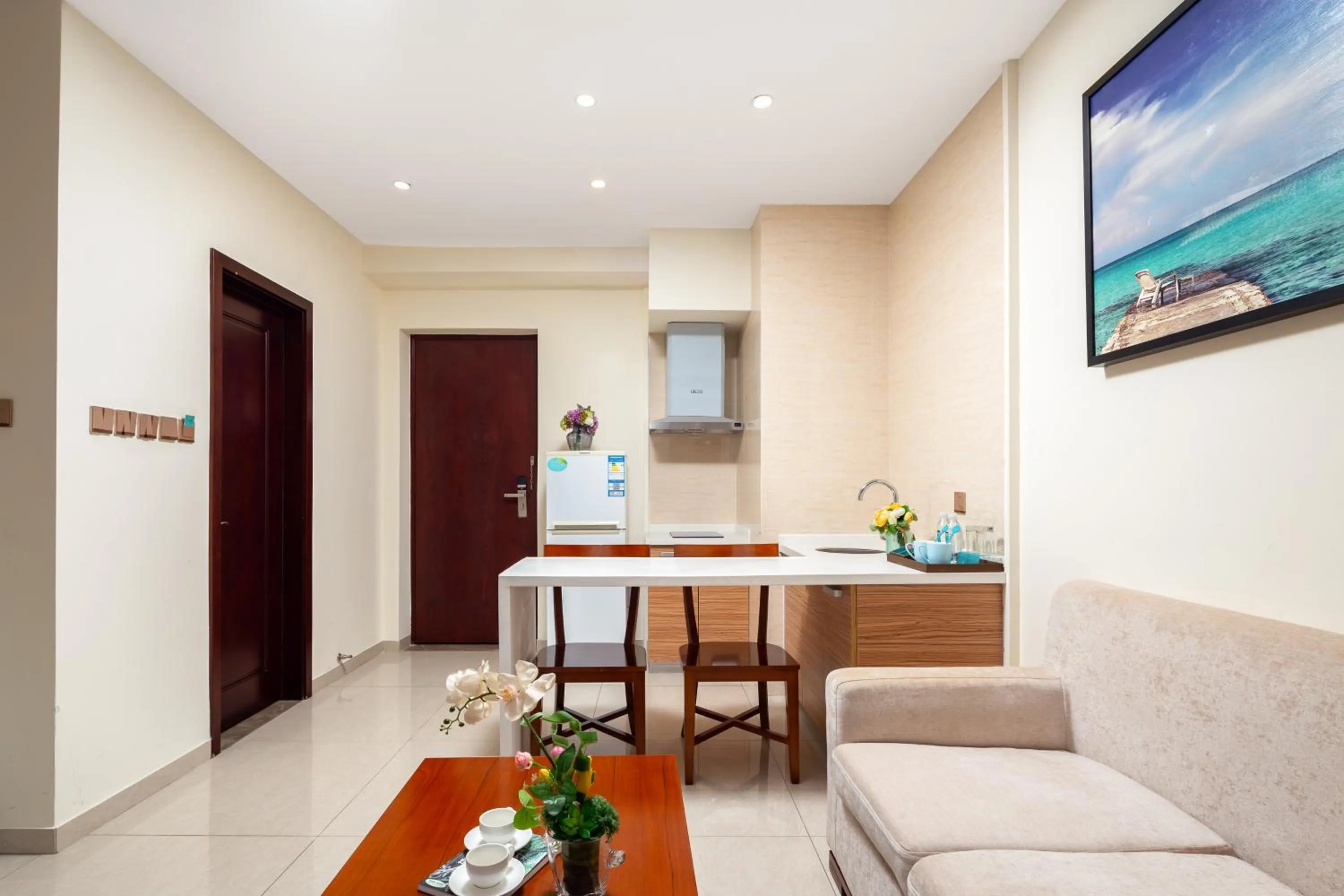 Seating area, TV/Entertainment Center in Paxton Vacances Hotel & Suite Sanya