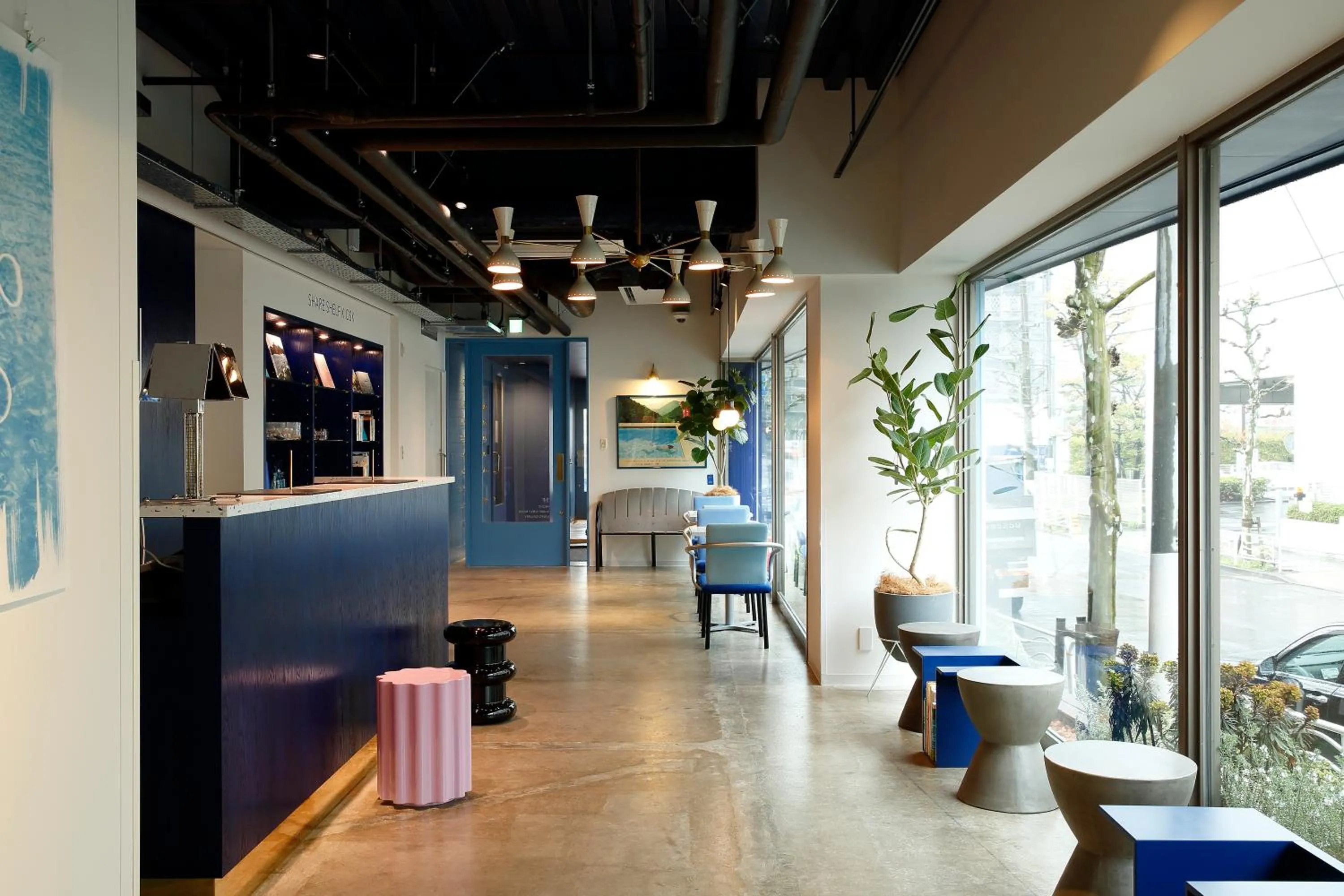 Communal lounge/ TV room in LYURO Tokyo Kiyosumi by THE SHARE HOTELS