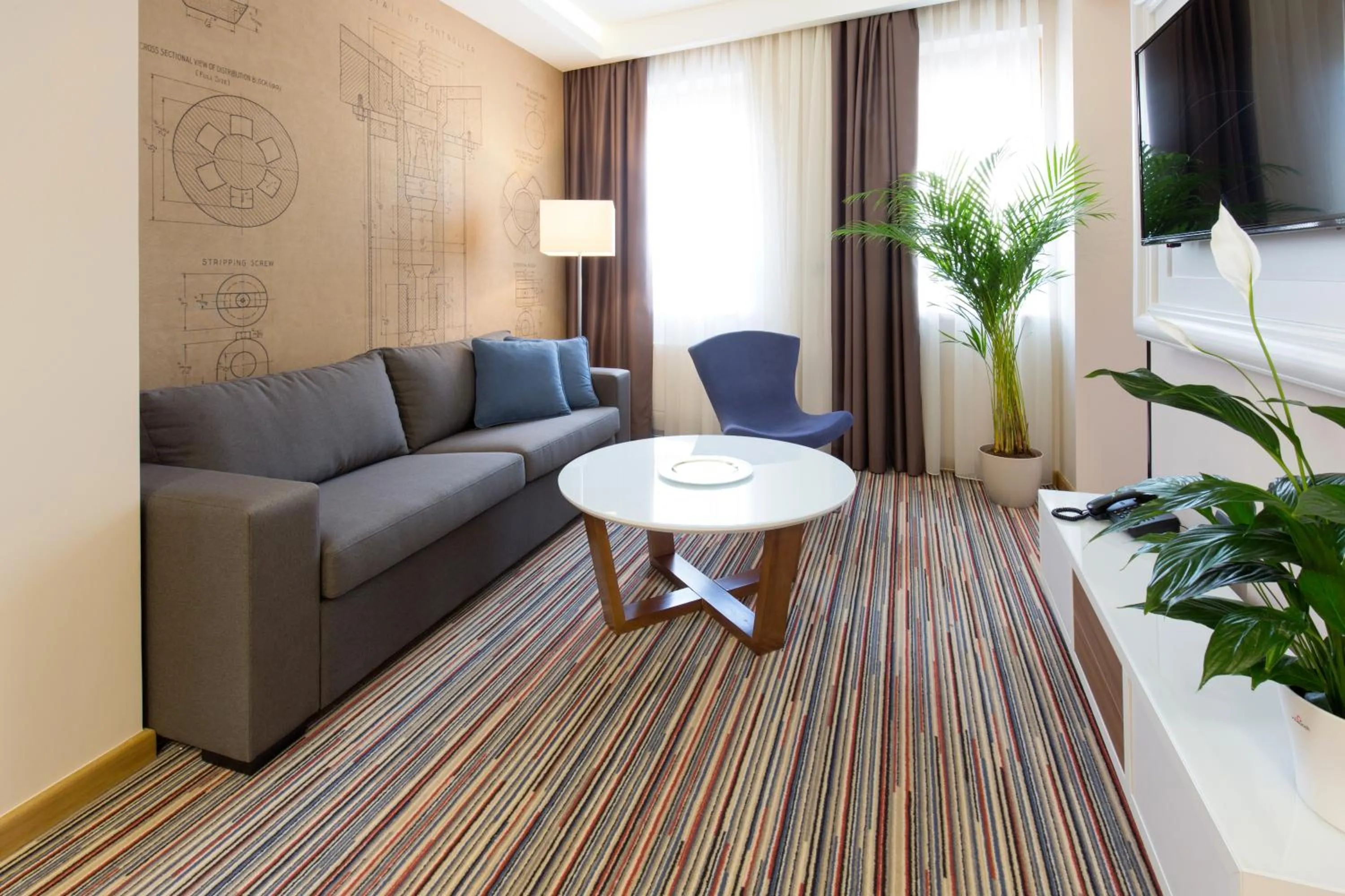 Living room in Hotel TESLA - Smart Stay Garni