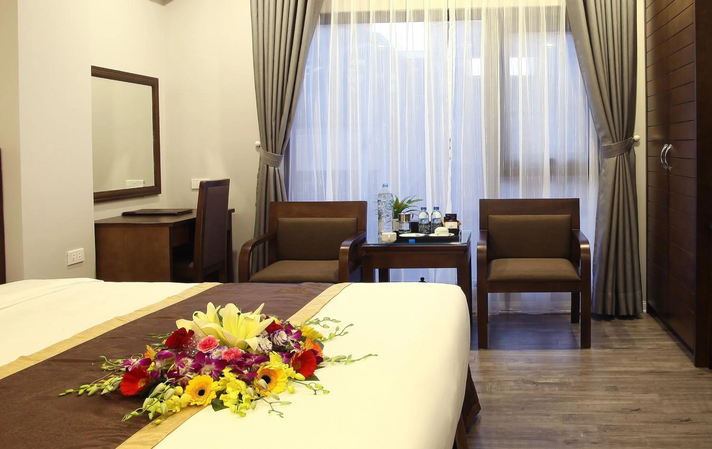 Bed in Blue Pearl West Hotel