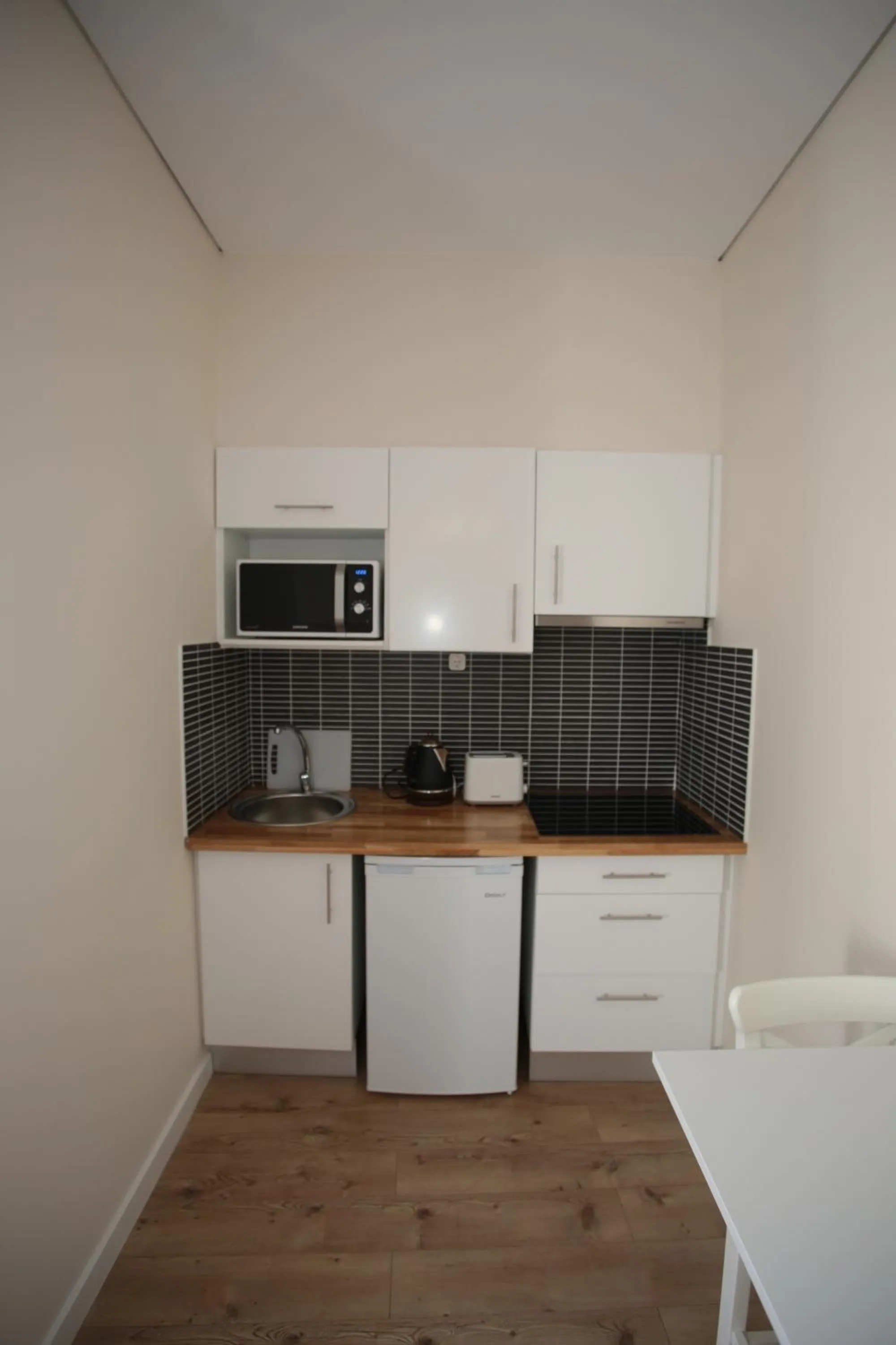 Kitchen or kitchenette in Suites Guest House