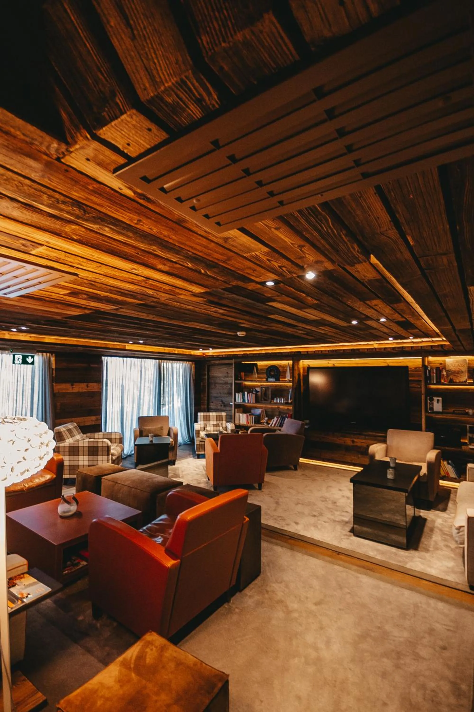 Communal lounge/ TV room in Chandolin Boutique Hotel