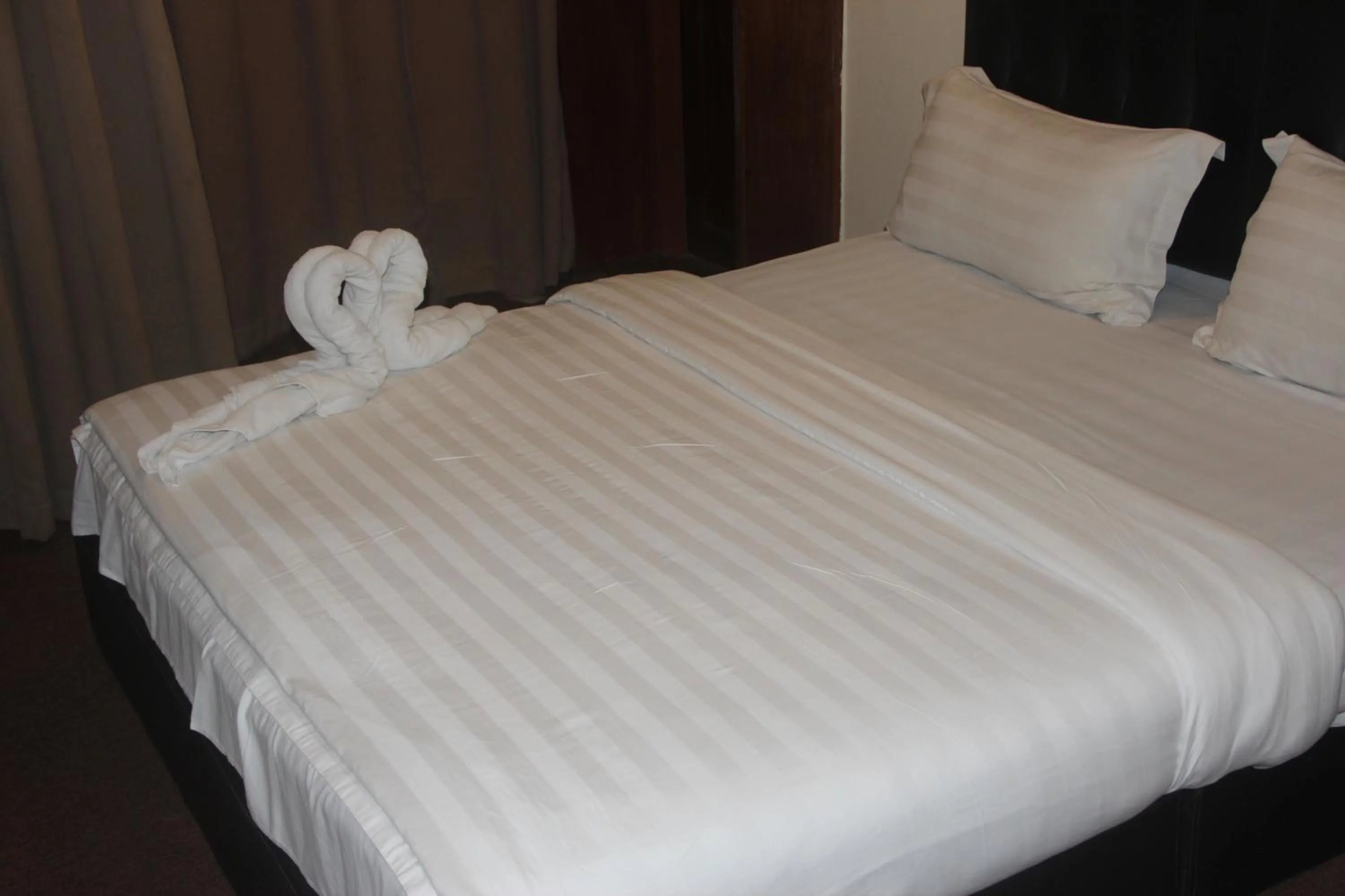 Bed in Alonto Hotel