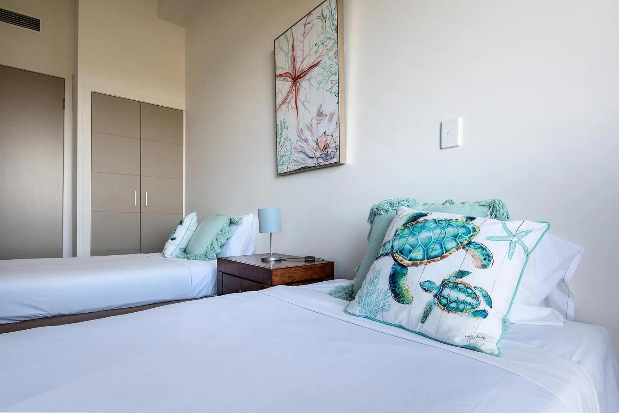 Bed in Coral Cove Apartments - Absolute Beachfront Resort Bowen