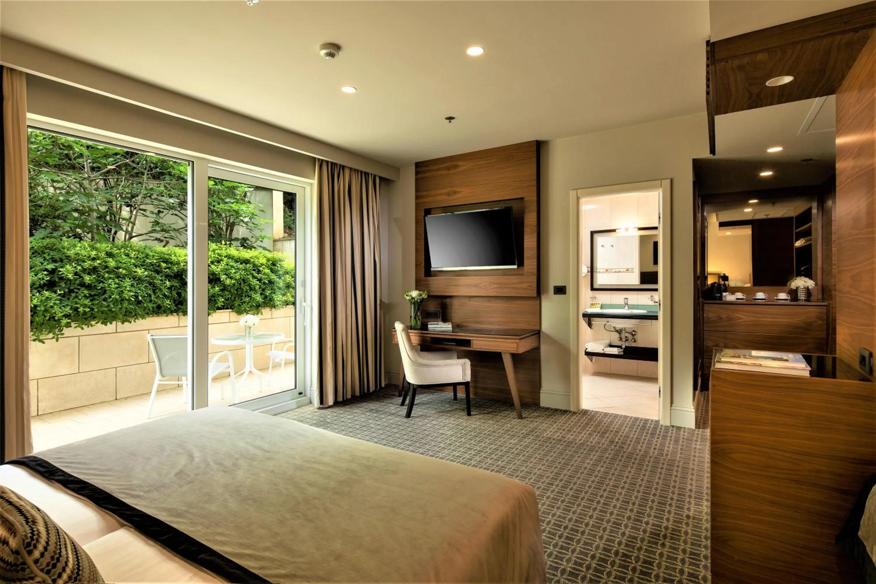 Bed in Royal Ariston Hotel