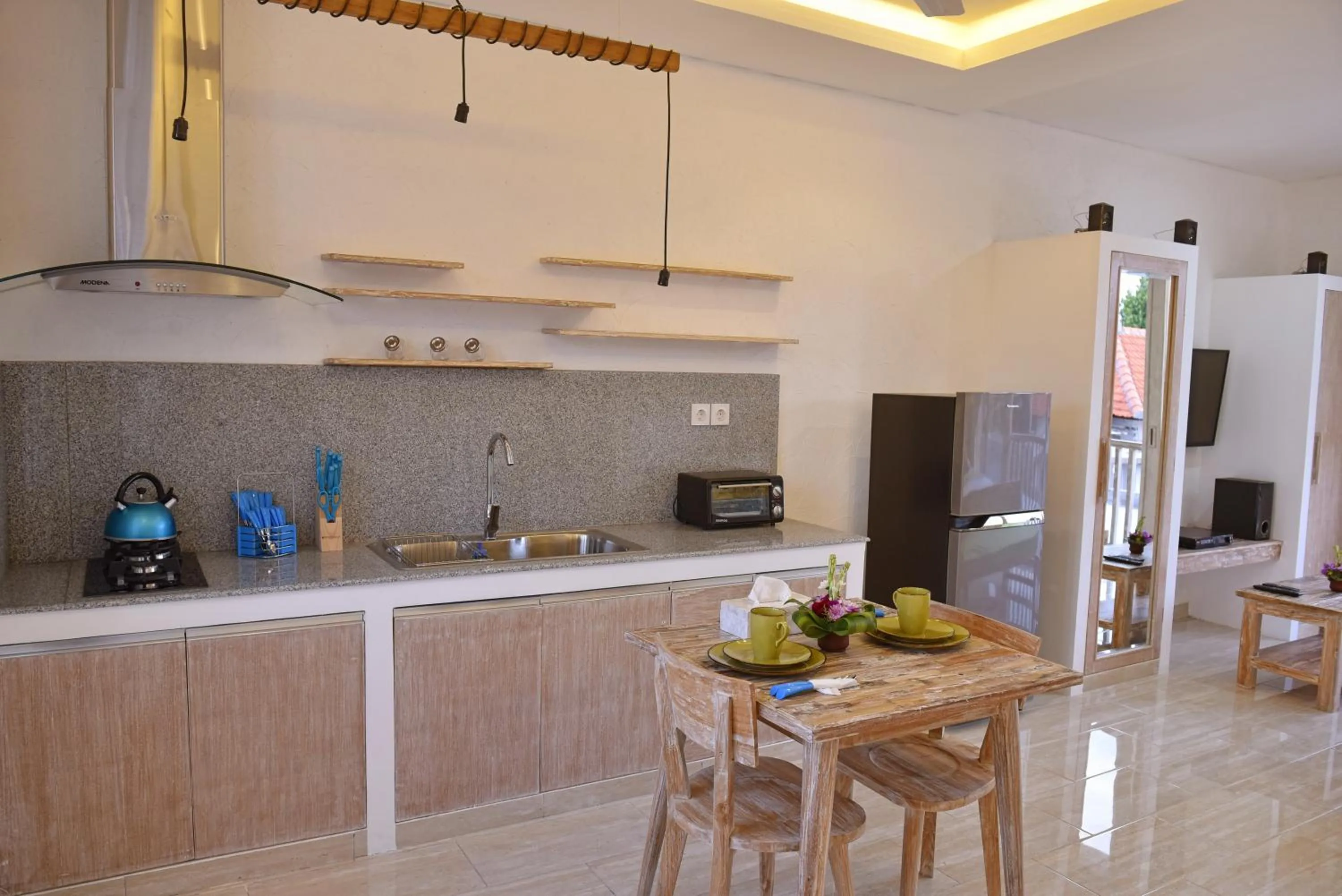 TV and multimedia in Green Studio Apartment Sanur