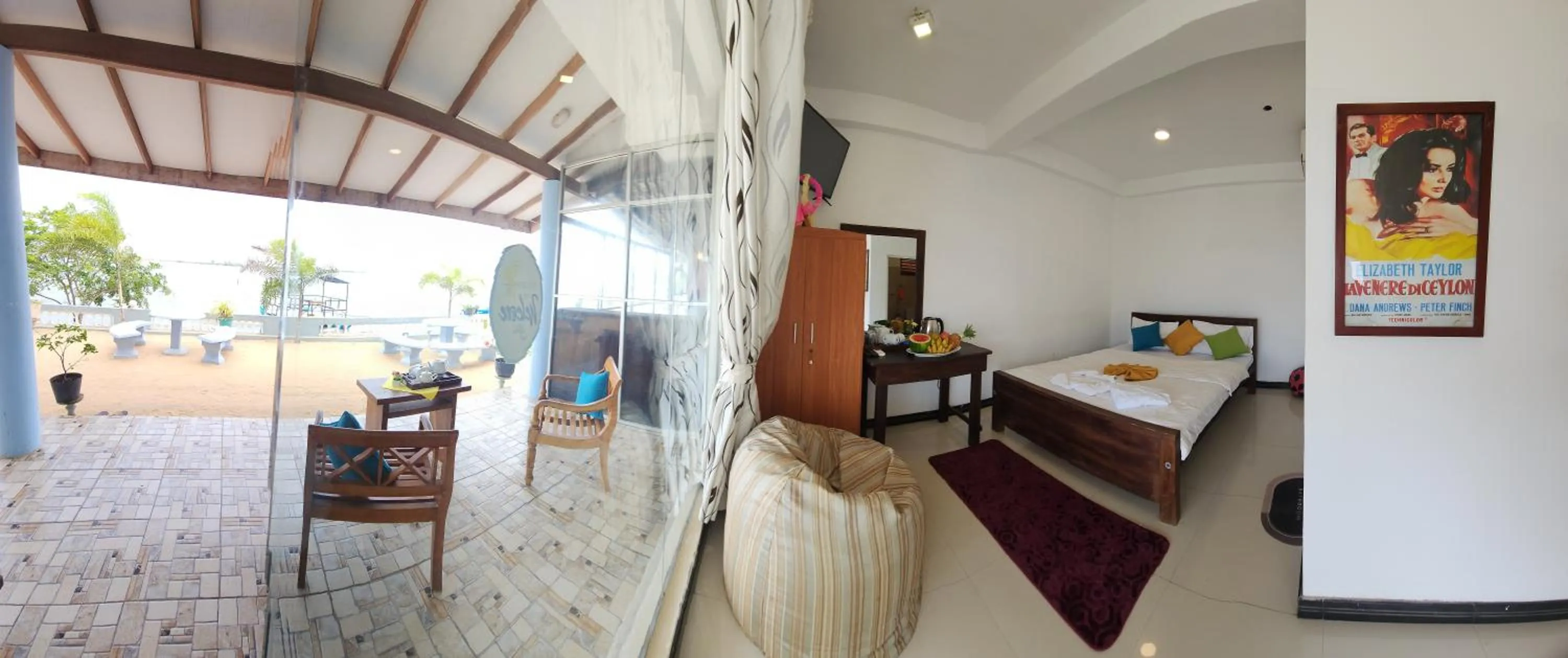 Seating area, Bed in Dinuda Lagoon Hotel