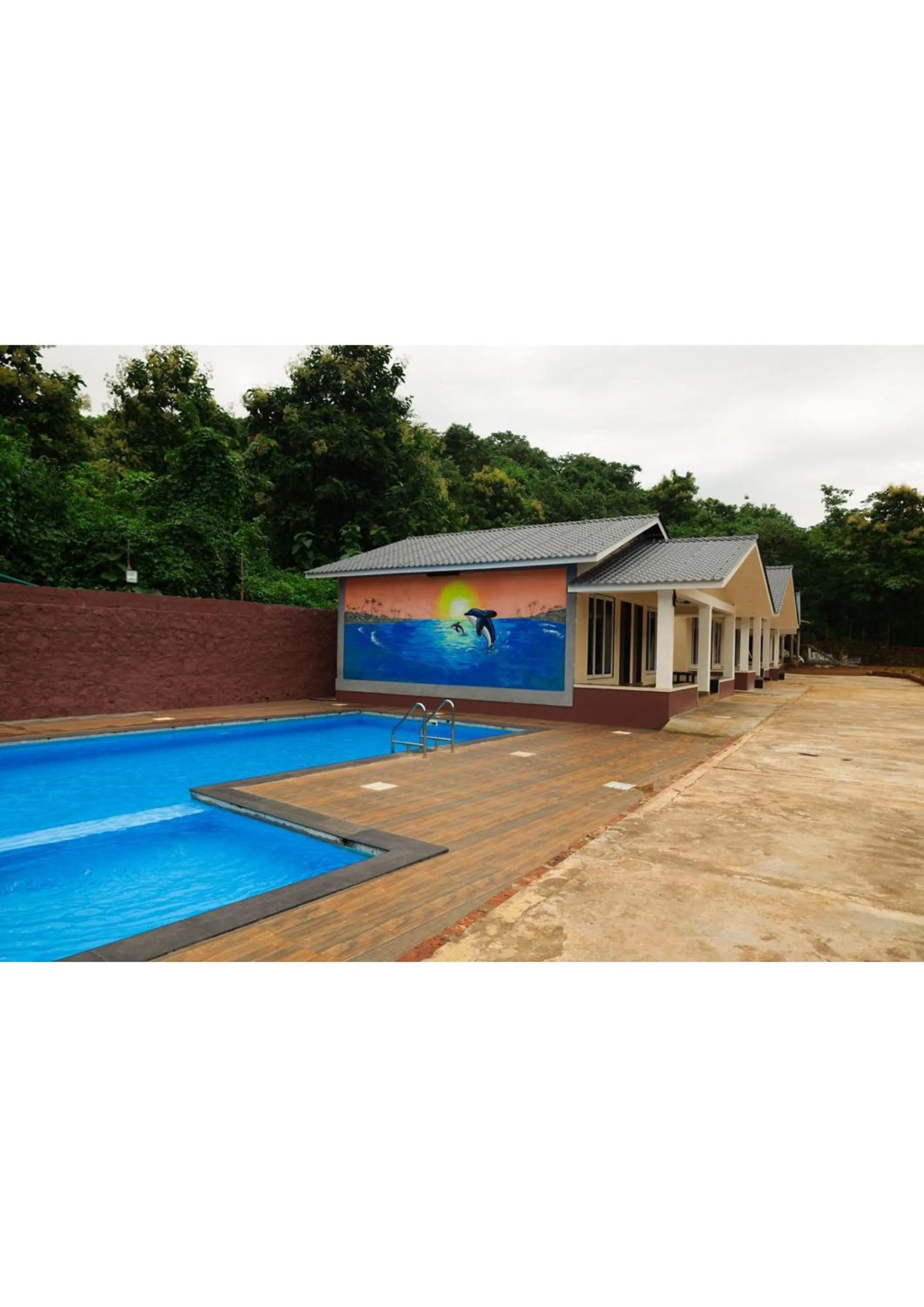 Swimming pool in Nisarg Resort