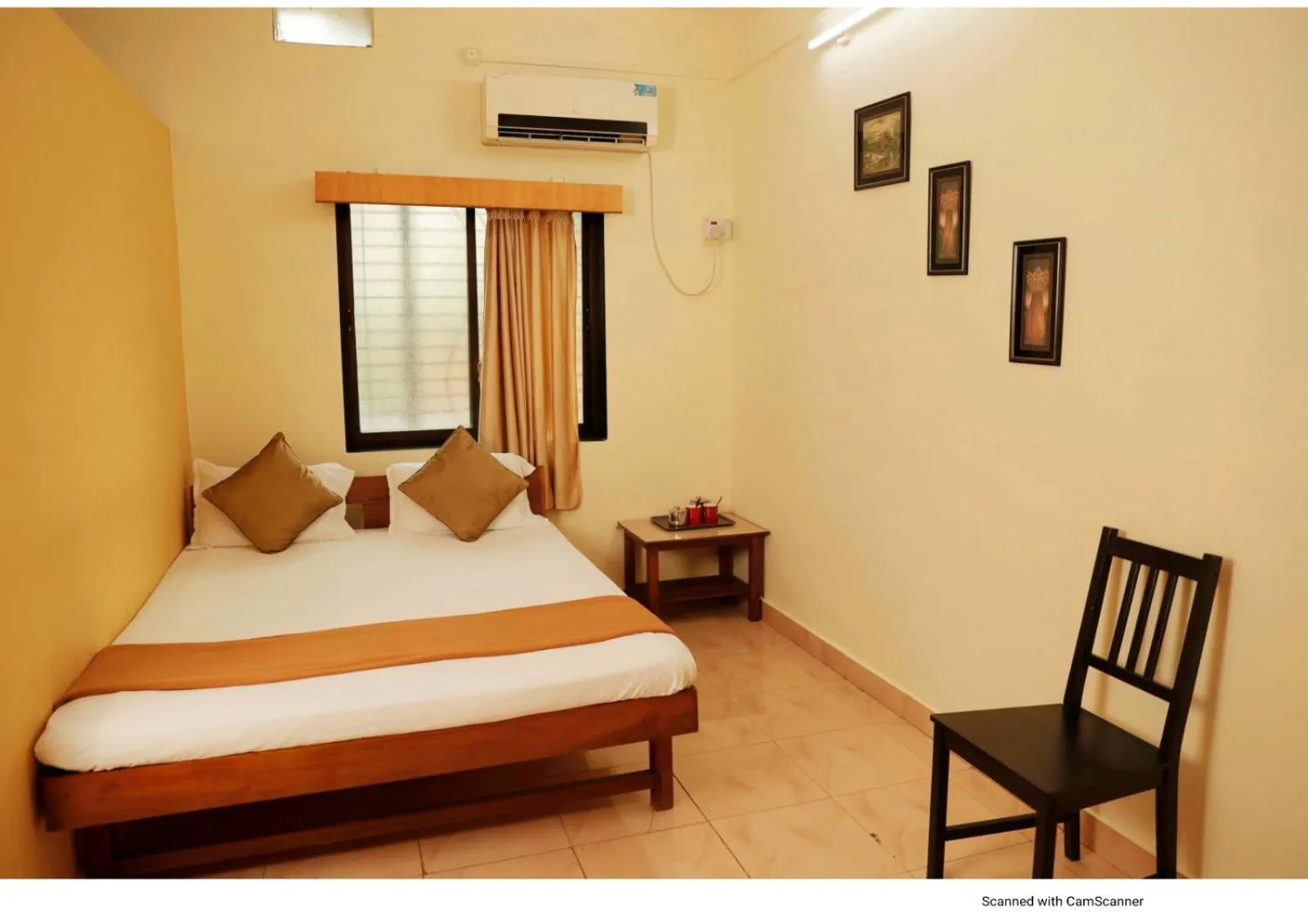 Bed in Nisarg Resort