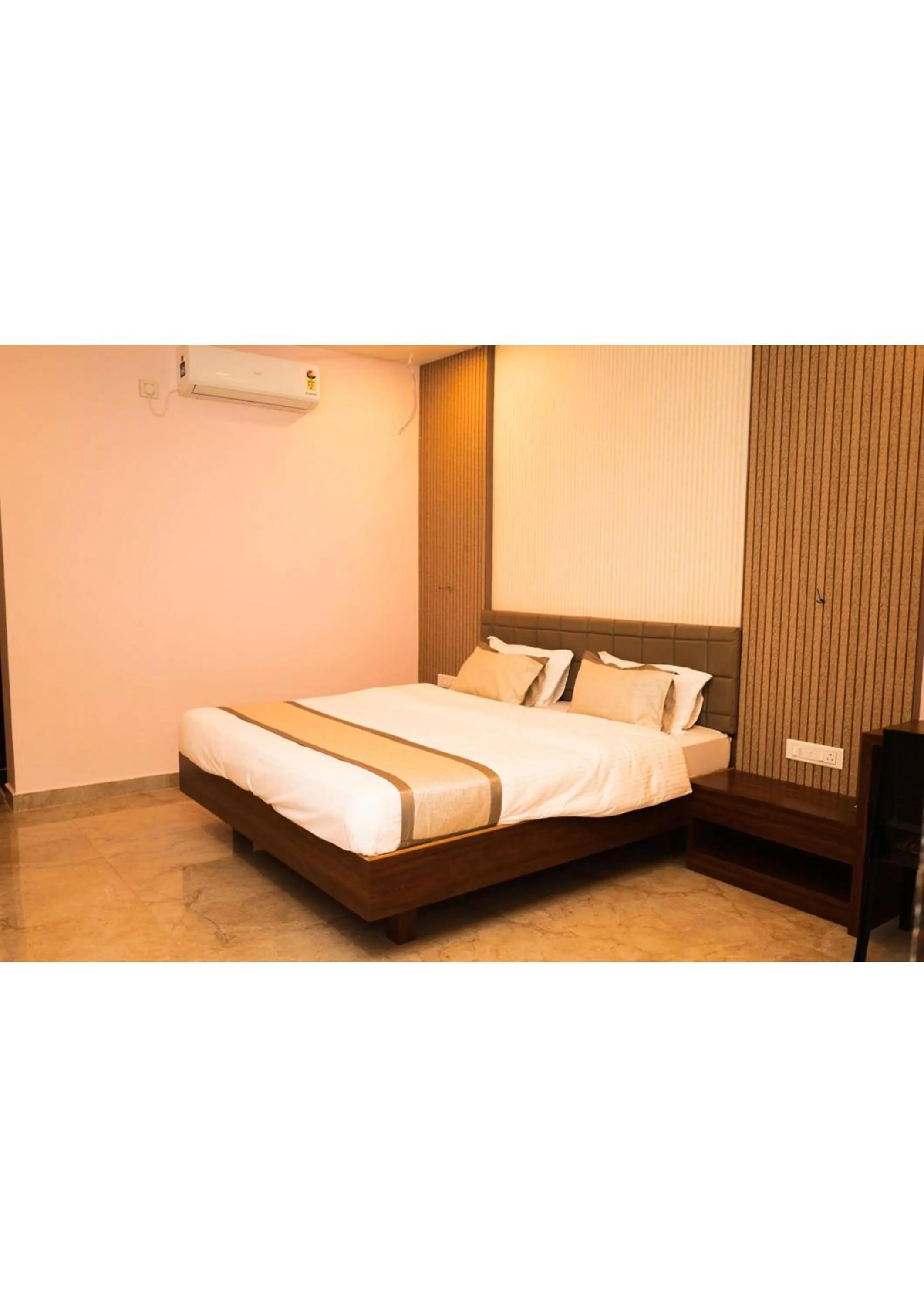 Bed in Nisarg Resort