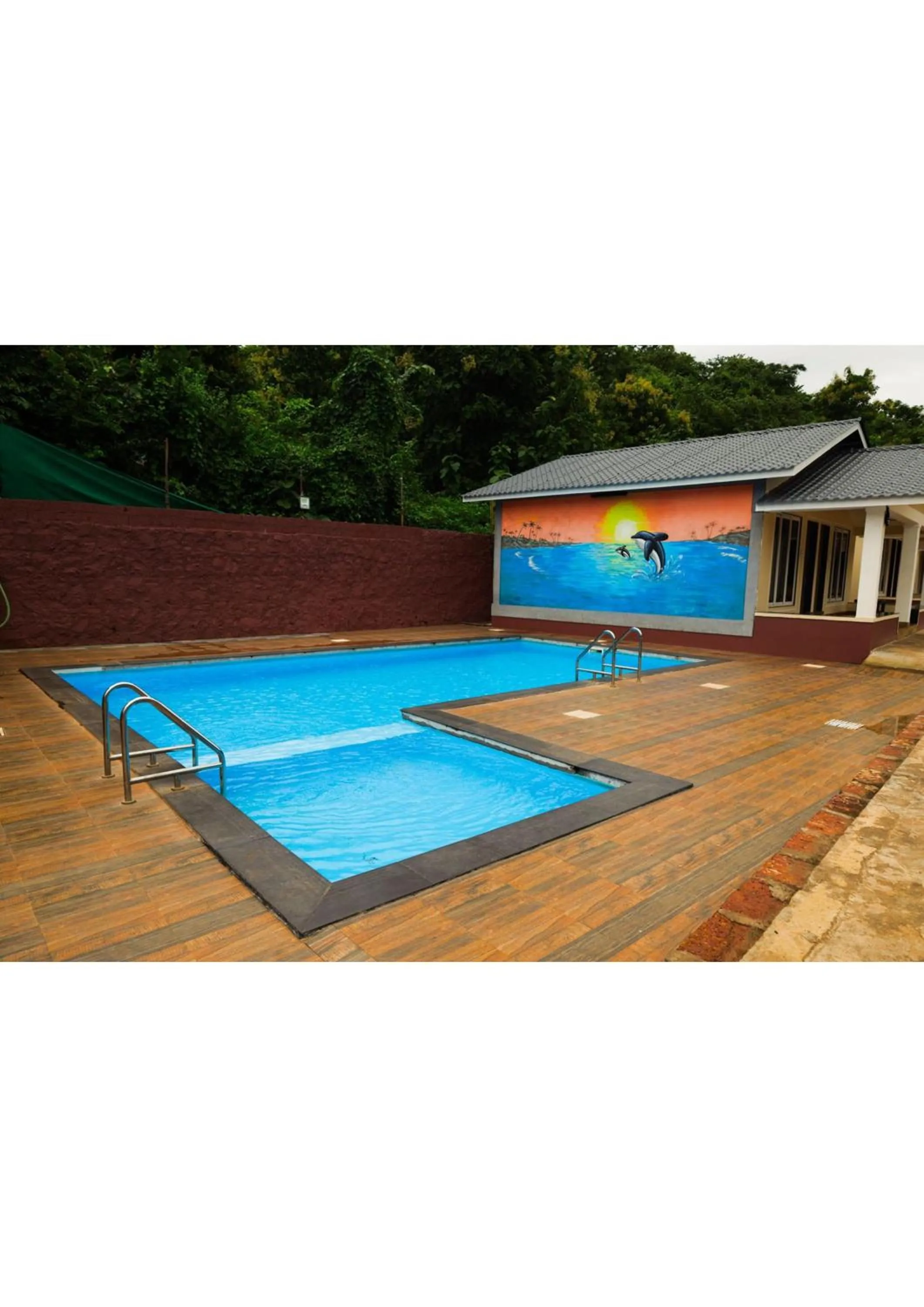 Swimming pool in Nisarg Resort