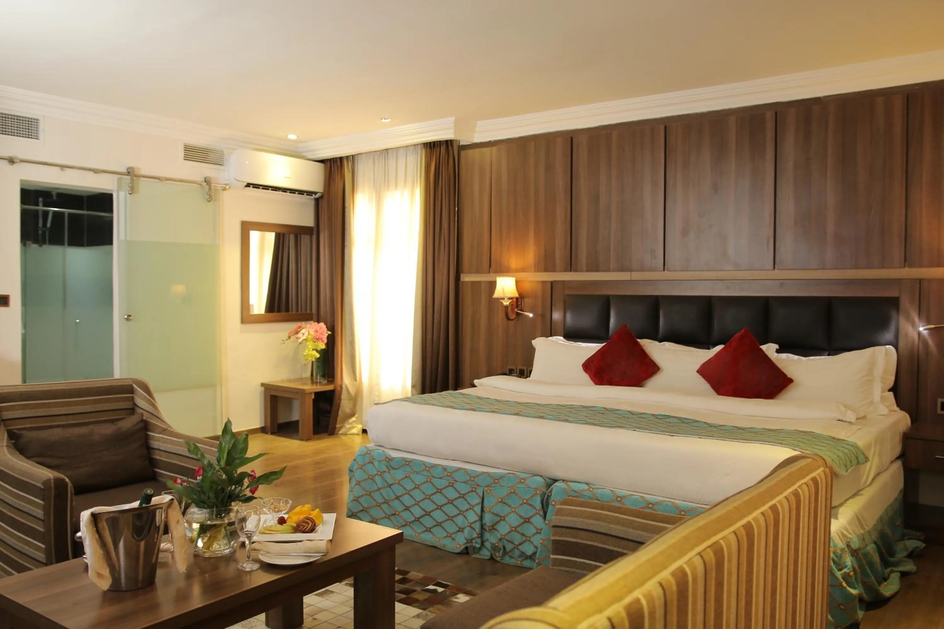 Bed in Grand Pela Hotel & Suites