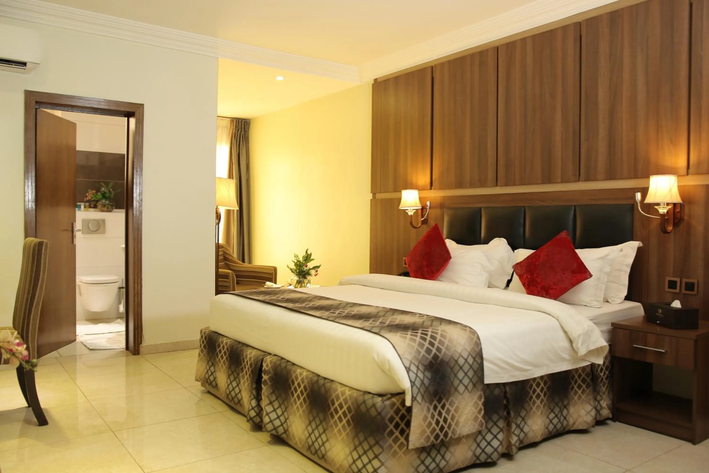 Bed in Grand Pela Hotel & Suites