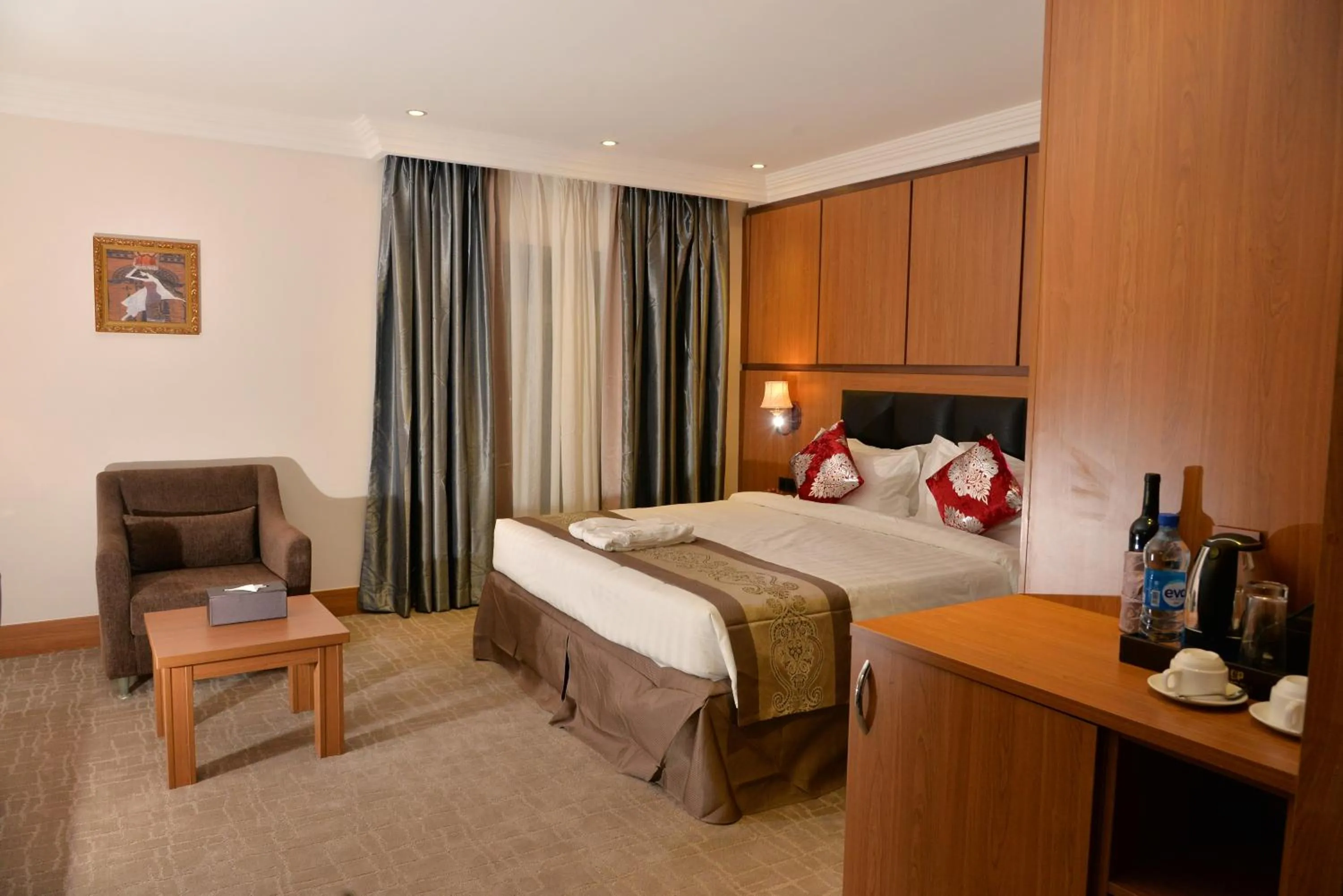 Bed in Grand Pela Hotel & Suites