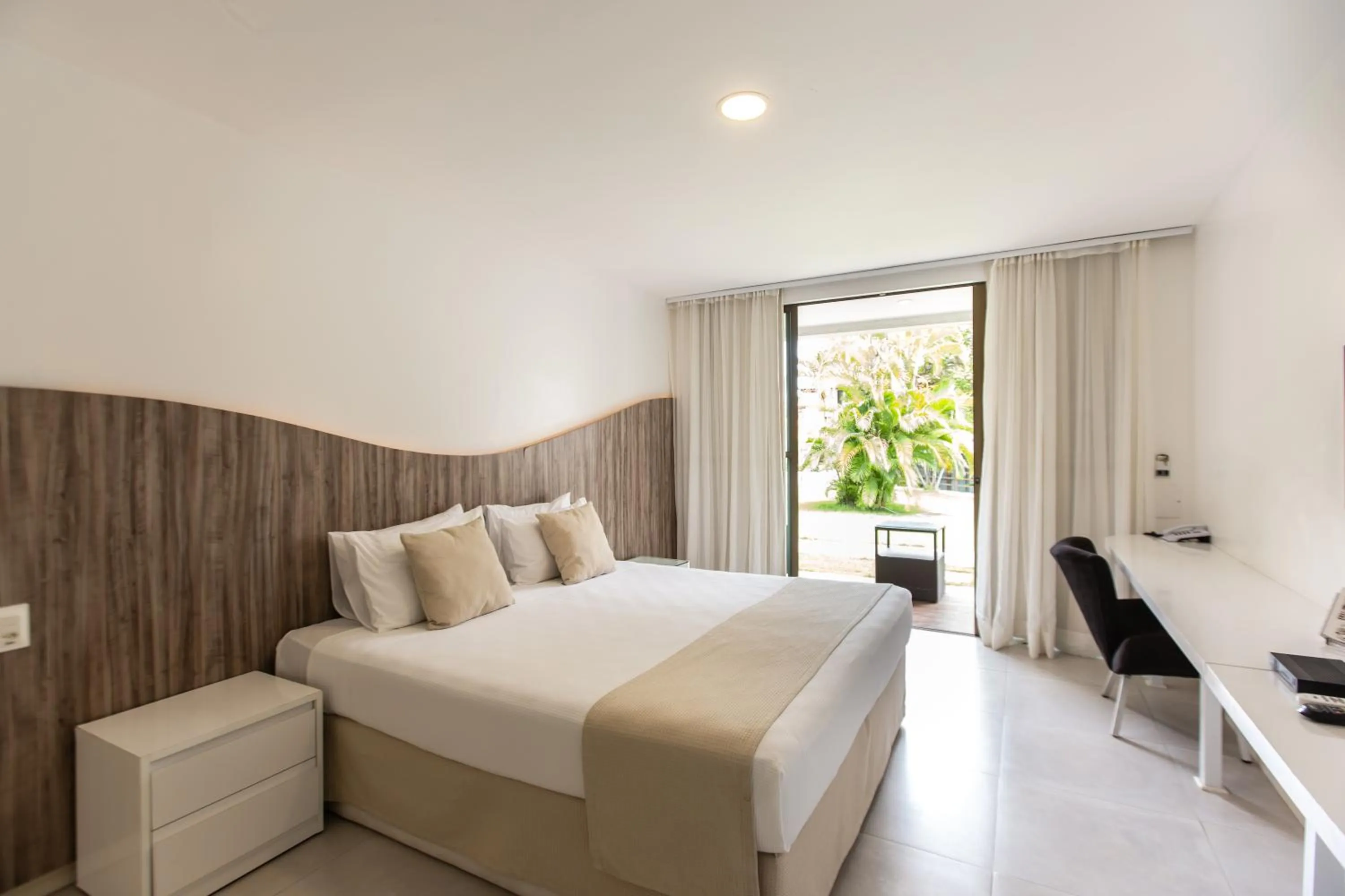 Bed in Duro Beach Garden Hotel